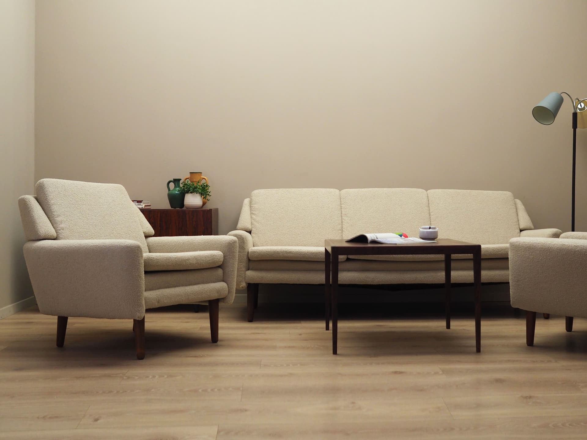 Armchair, ivory bouclé, rosewood, Denmark, 1970s. - 78644