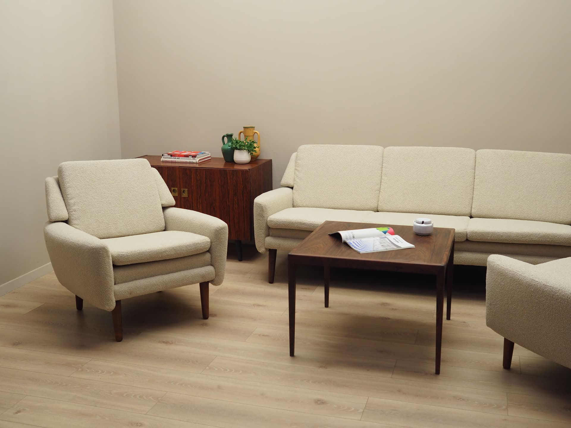 Armchair, ivory bouclé, rosewood, Denmark, 1970s. - 78648
