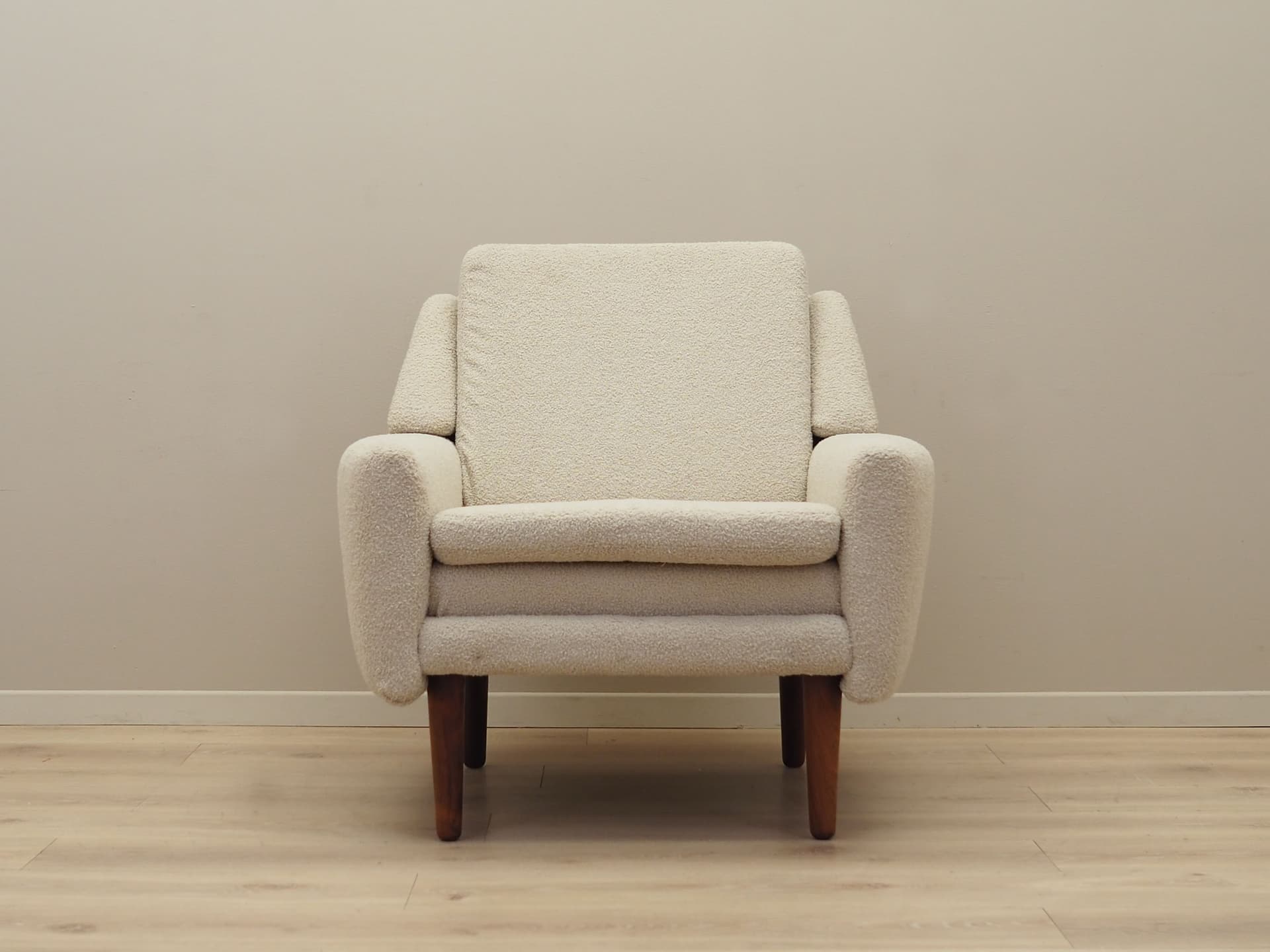 Armchair, ivory bouclé, rosewood, Denmark, 1970s. - 78640