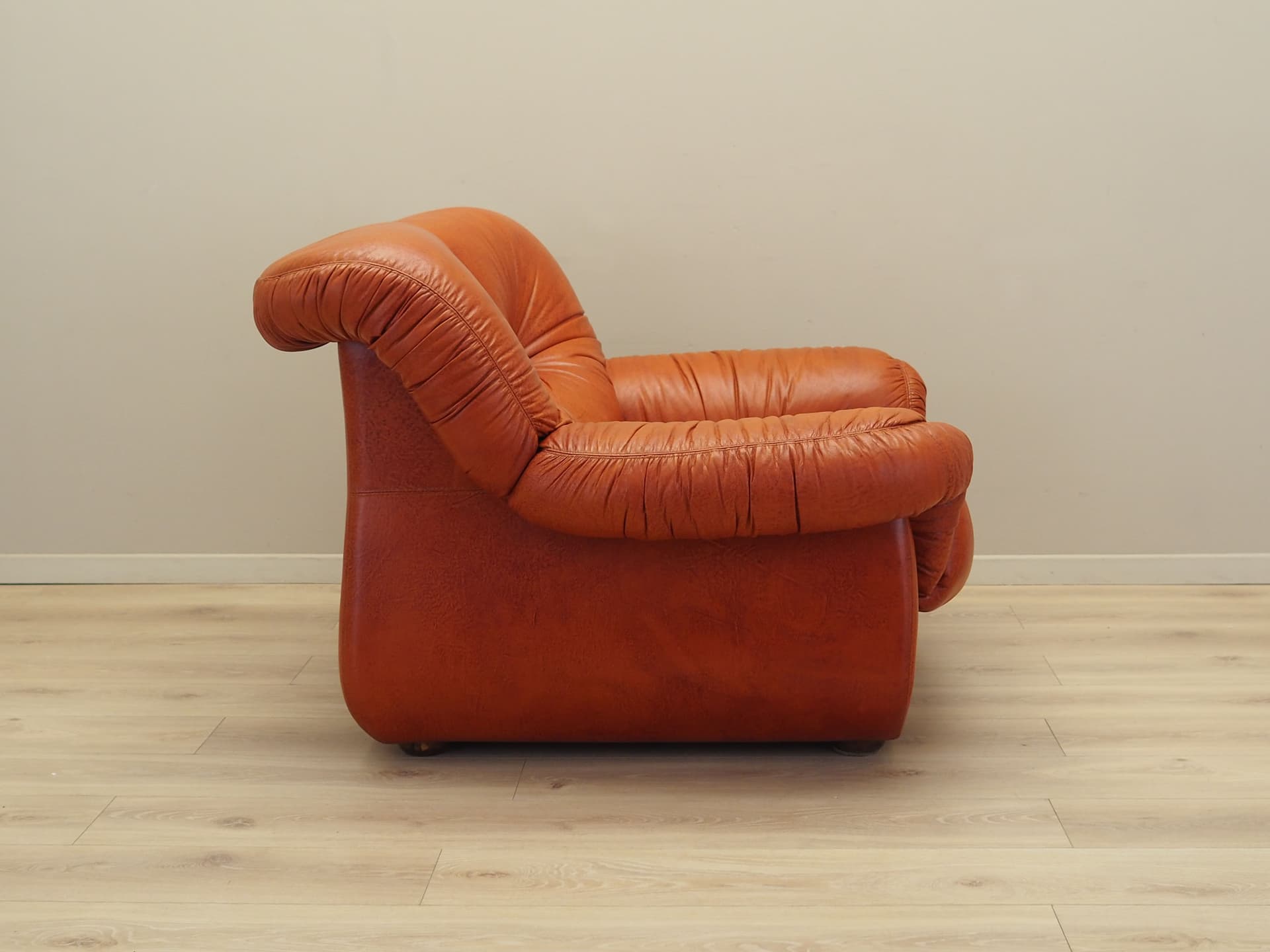 Lounge chair, burnt orange, natural leather, Italy, 1970s. - 81733