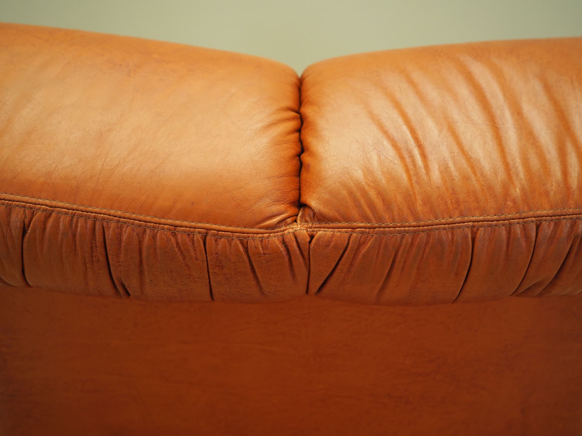 Lounge chair, burnt orange, natural leather, Italy, 1970s. - 81742