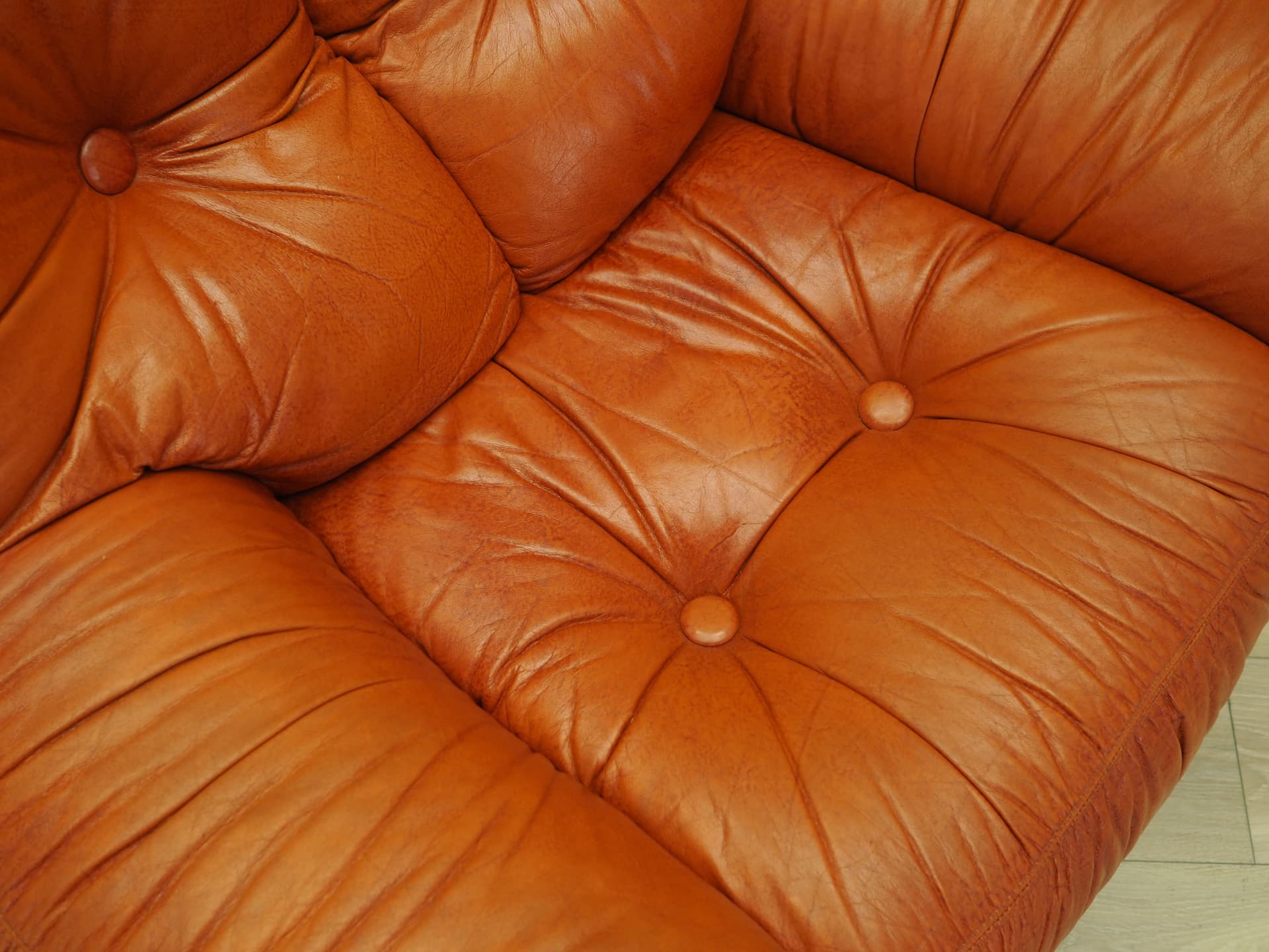 Lounge chair, burnt orange, natural leather, Italy, 1970s. - 81743