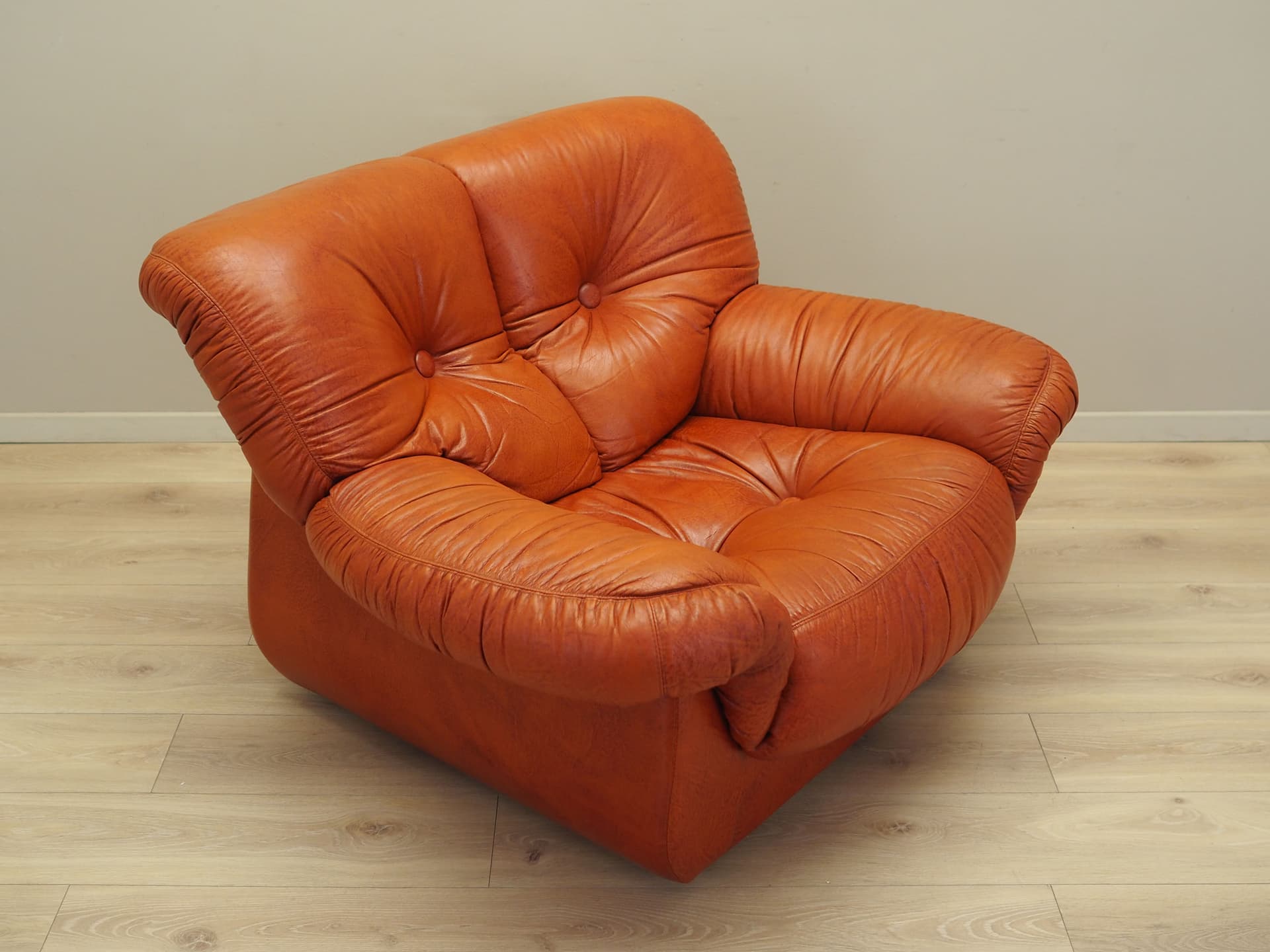 Lounge chair, burnt orange, natural leather, Italy, 1970s. - 81735