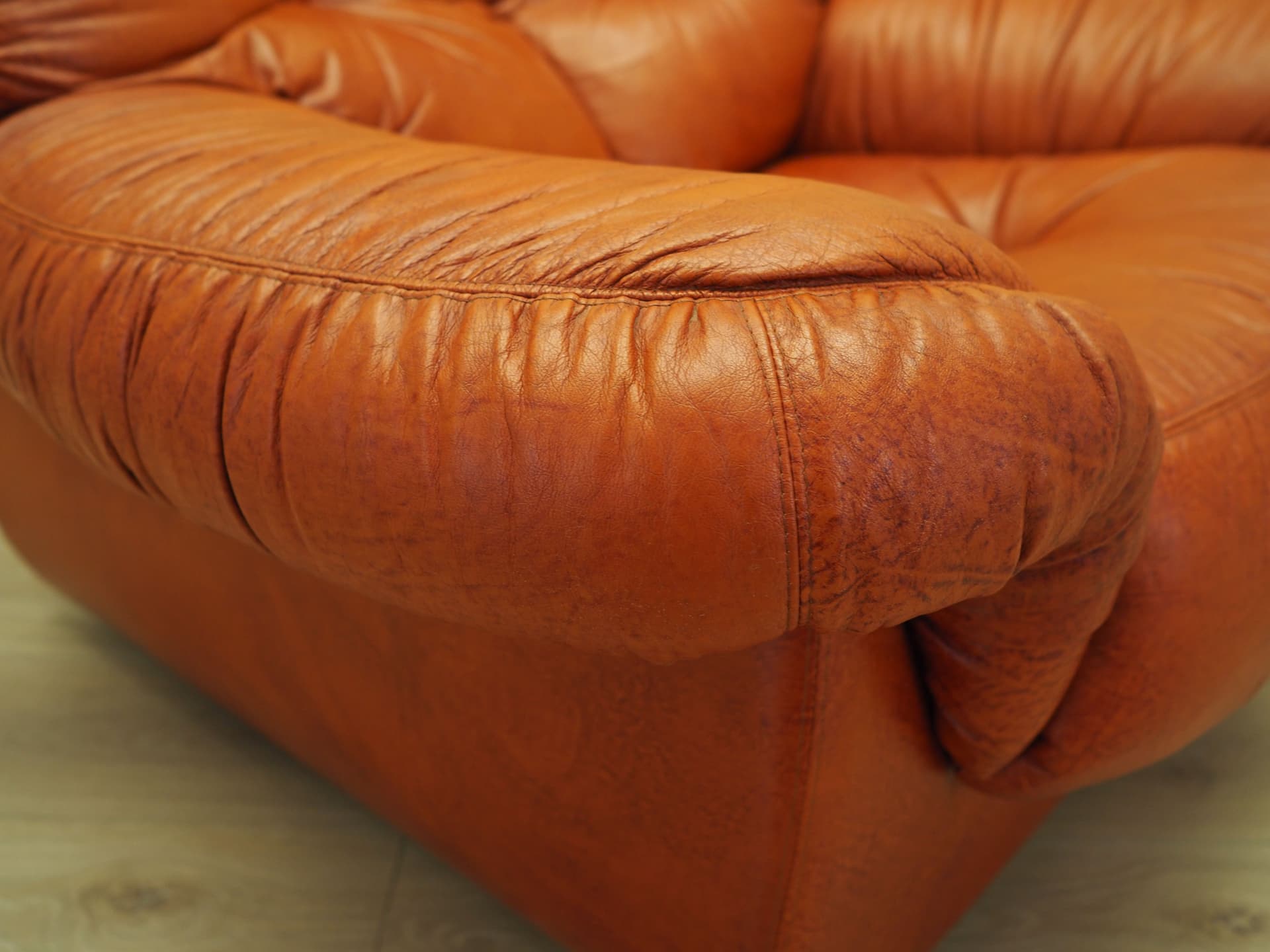 Lounge chair, burnt orange, natural leather, Italy, 1970s. - 81740