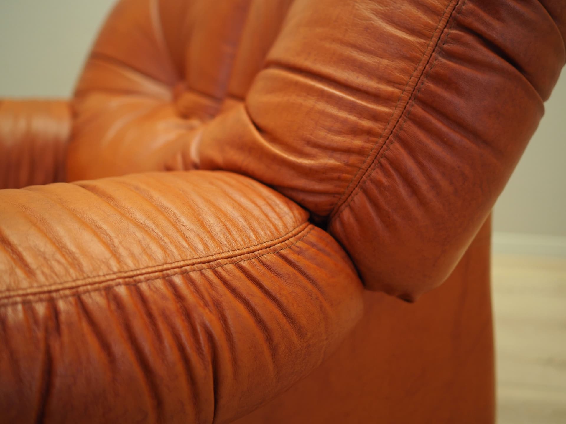 Lounge chair, burnt orange, natural leather, Italy, 1970s. - 81741