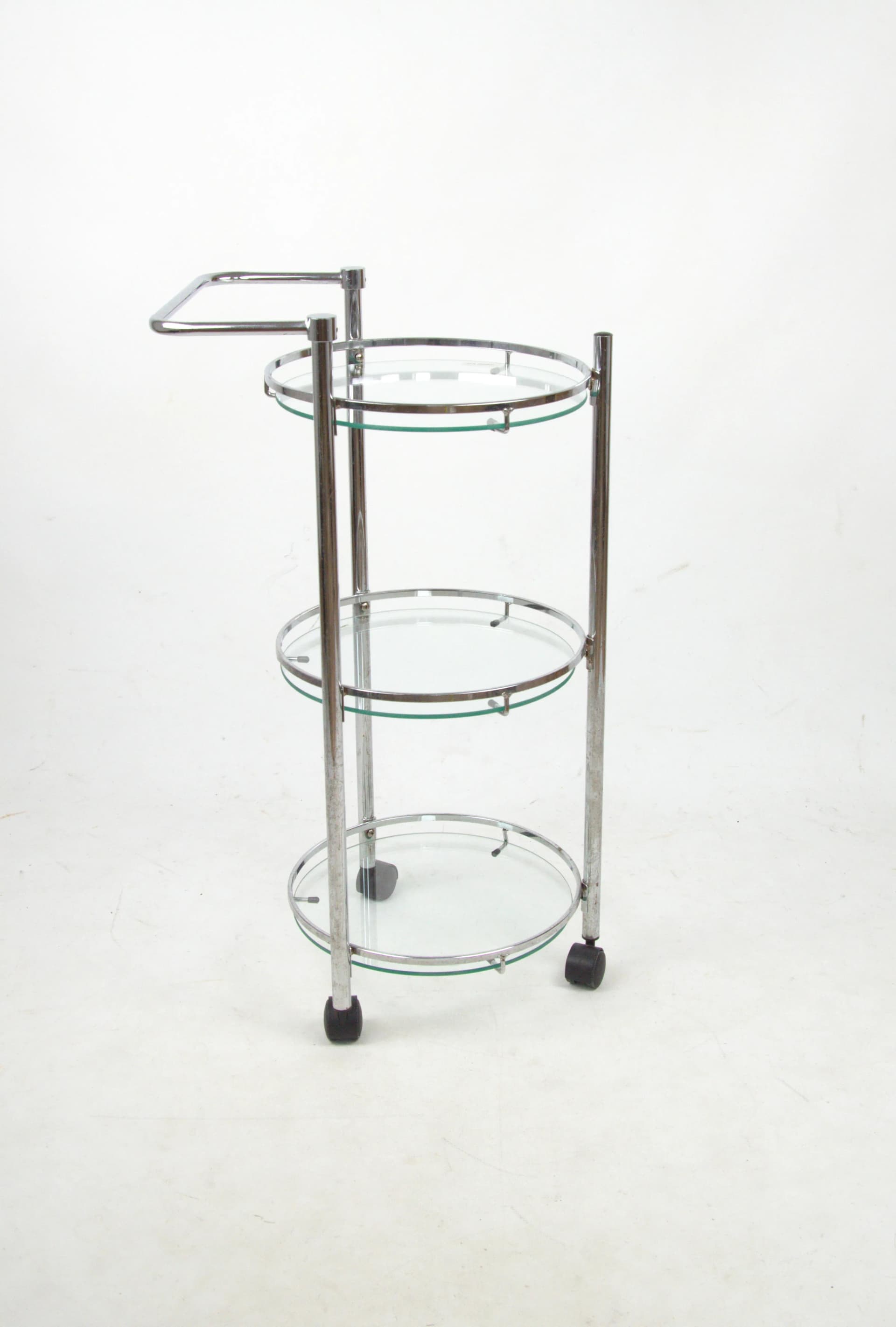 Mobile shelving unit, silver chrome, transparent glass, Poland, 1980s. - 85426