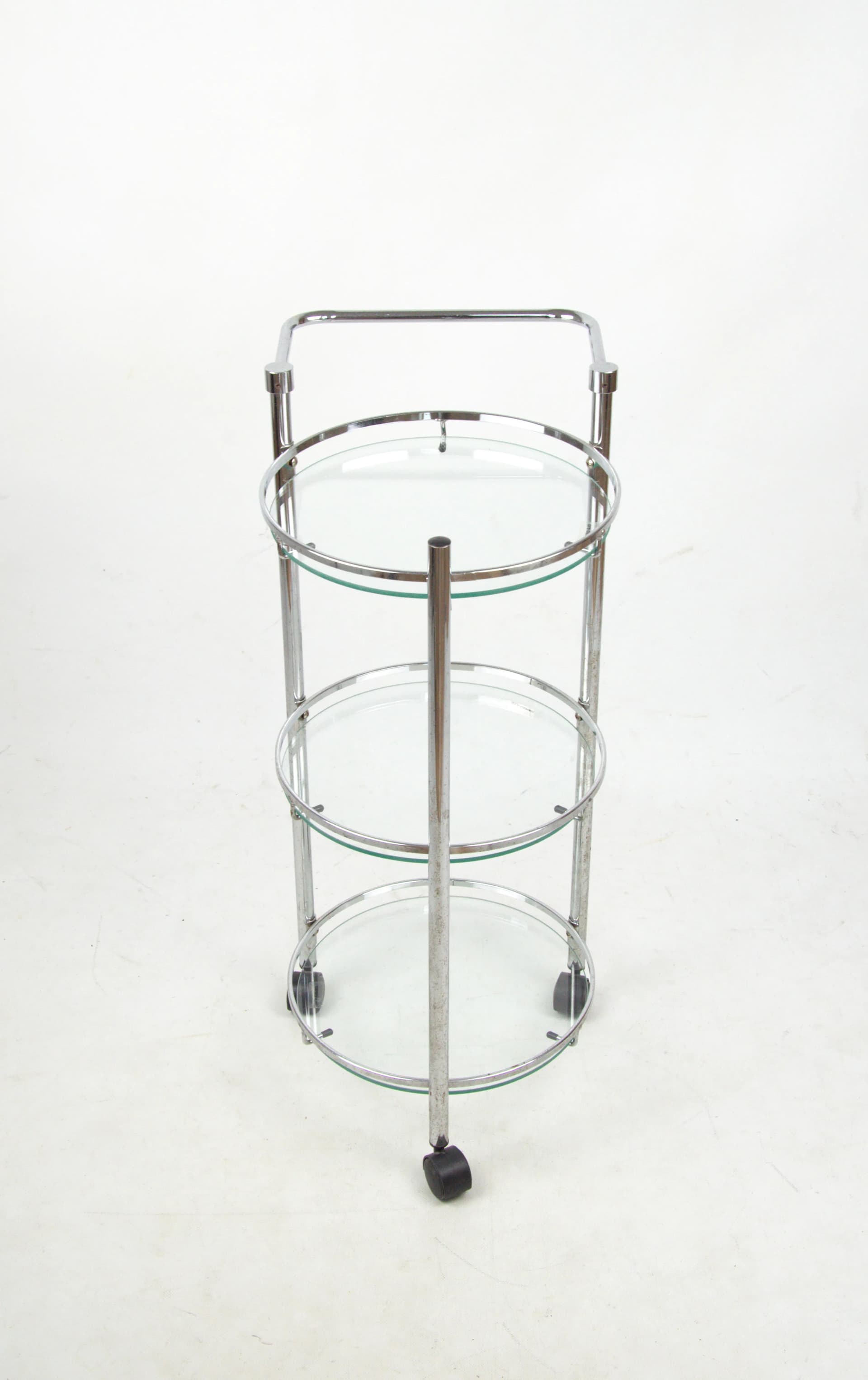 Mobile shelving unit, silver chrome, transparent glass, Poland, 1980s. - 85425