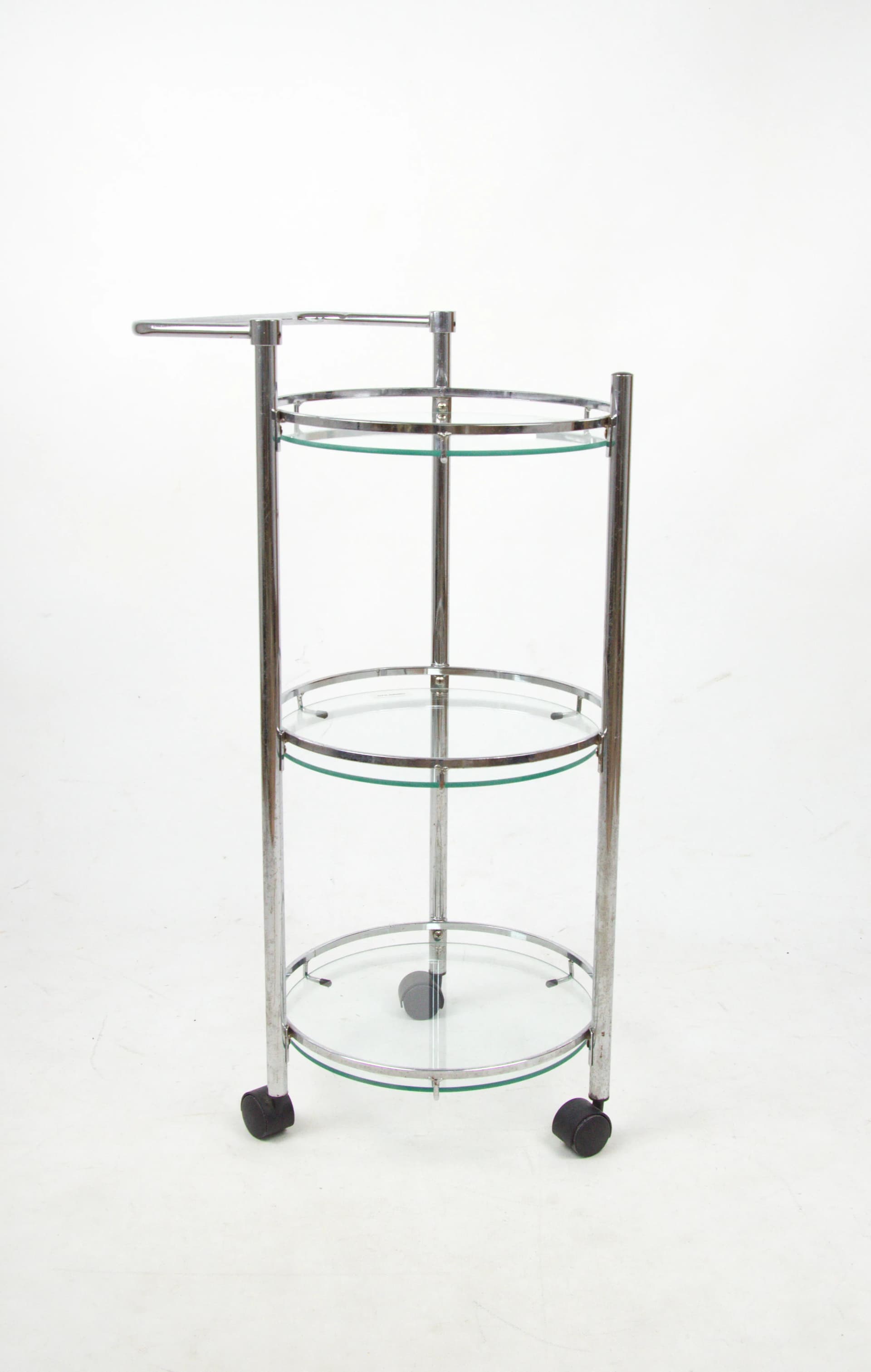 Mobile shelving unit, silver chrome, transparent glass, Poland, 1980s. - 85424