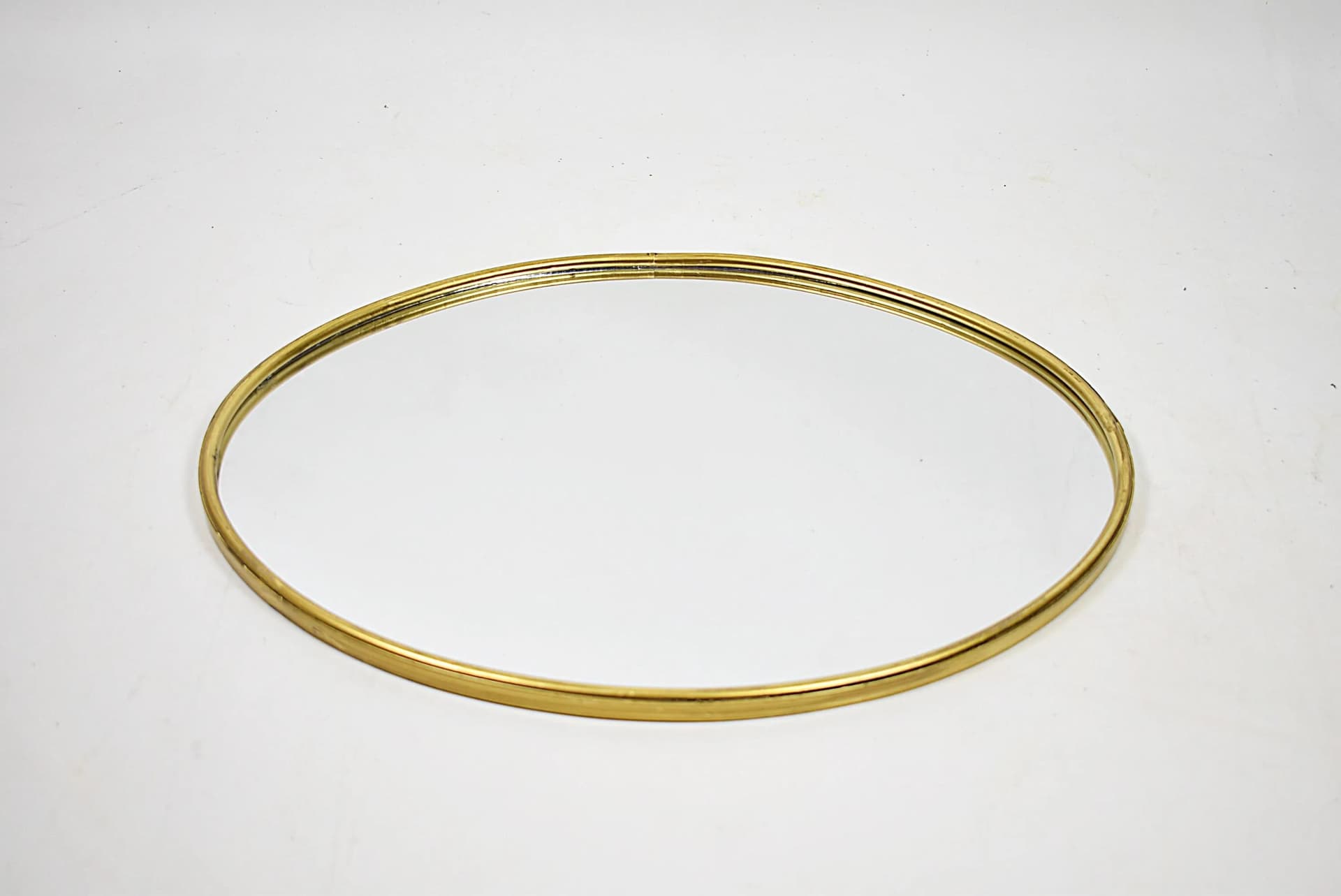 Wall mirror, oval, golden brass, Poland, 1980s - 84145