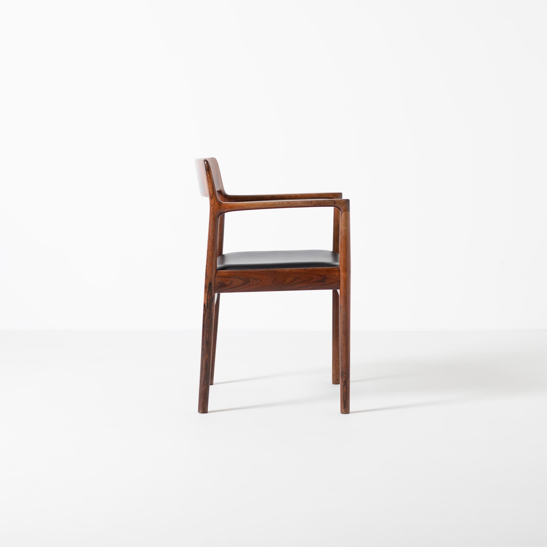 Armchair, brown rosewood, black leather, by J. Norgaard, Denmark, 1960s. - 93928