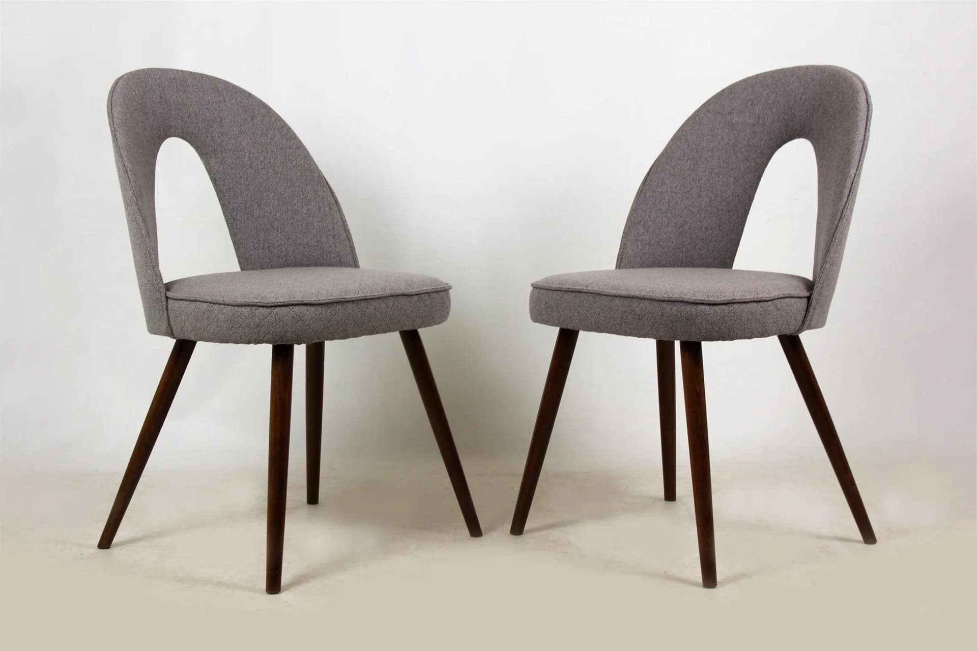 Pair of chairs, grey fabric, brown wood, by A. Šuman, Czech Republic, 1960s. - 98339