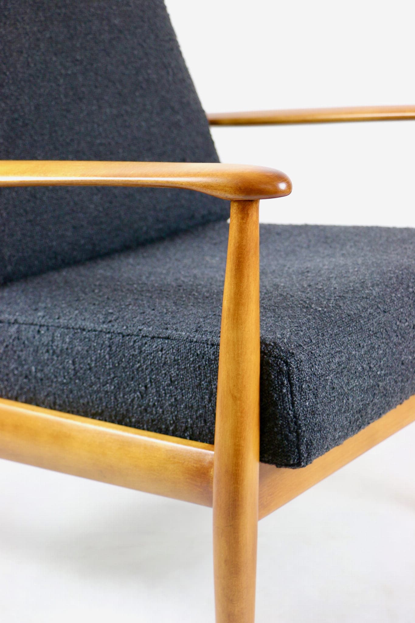 Armchair, black bouclé, wood, Denmark, 1970s. - 107372