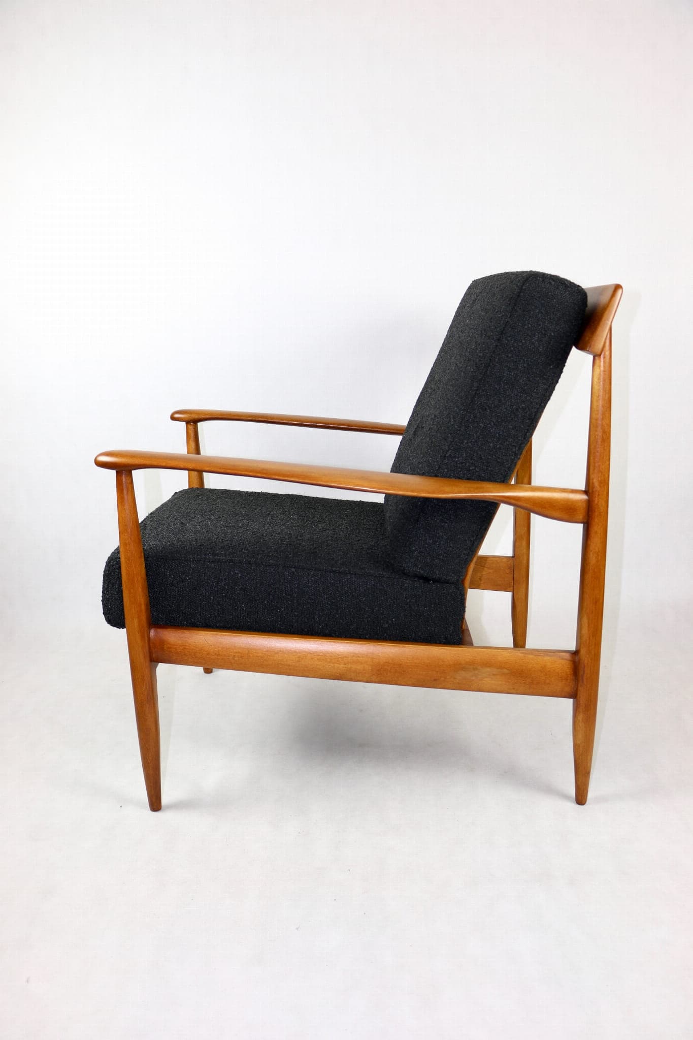 Armchair, black bouclé, wood, Denmark, 1970s. - 107376