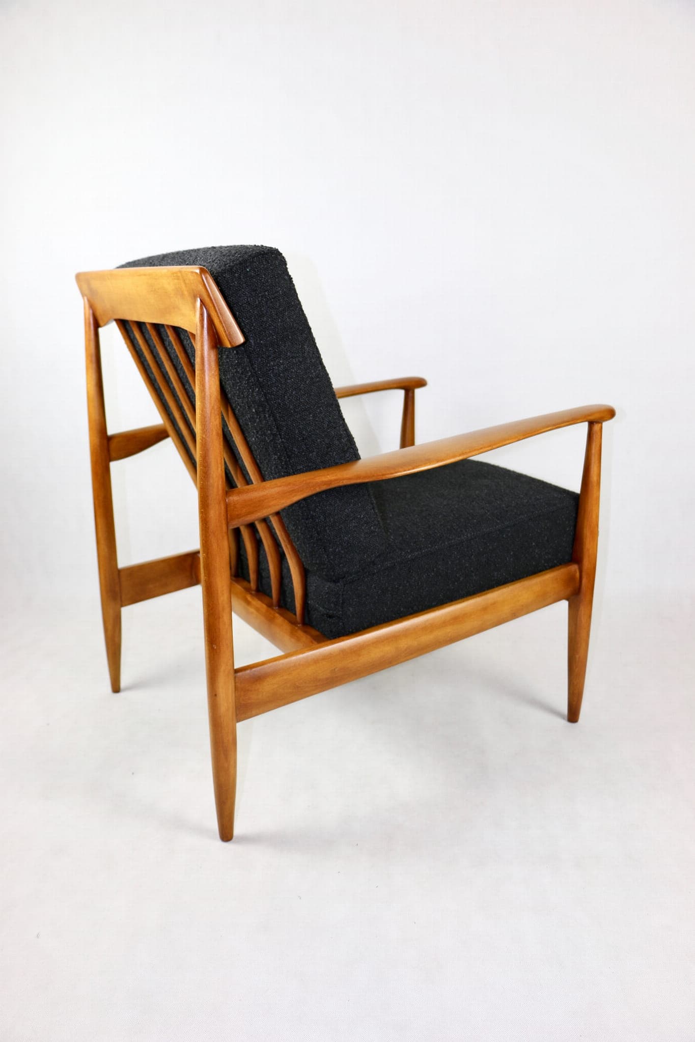Armchair, black bouclé, wood, Denmark, 1970s. - 107379