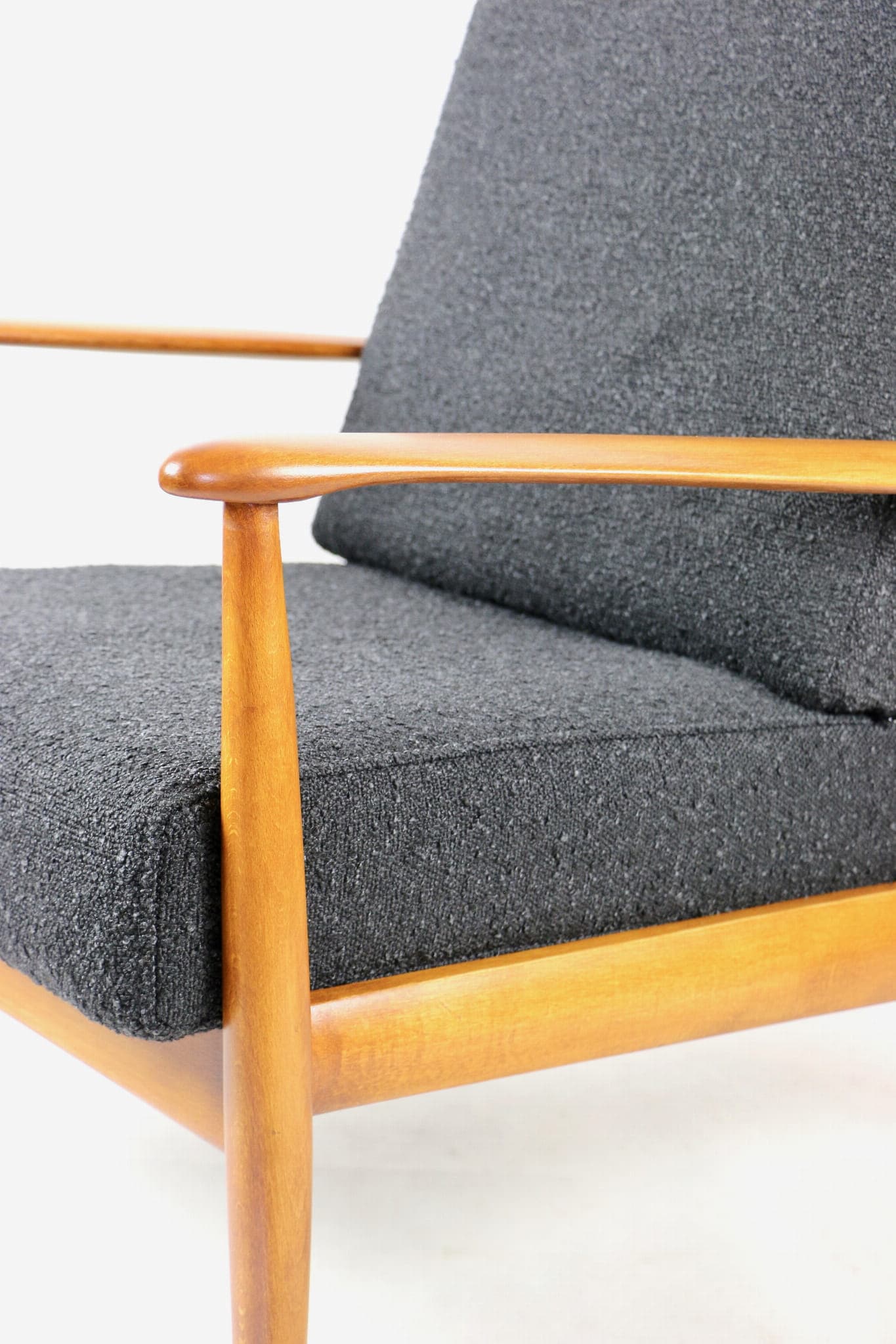 Armchair, black bouclé, wood, Denmark, 1970s. - 107375