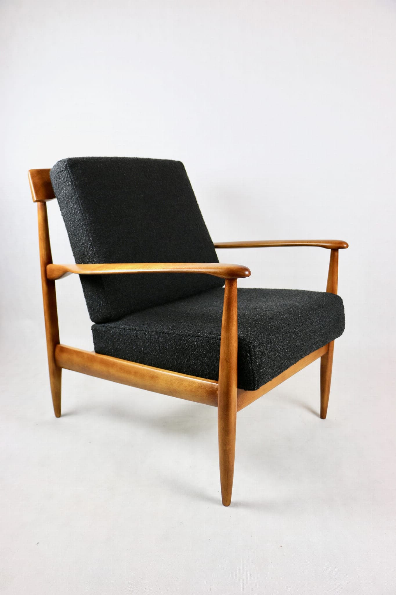 Armchair, black bouclé, wood, Denmark, 1970s. - 107377