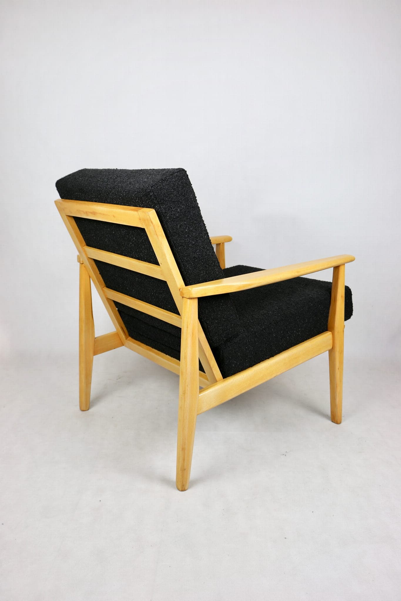 Armchair, black boucle, light wood, Denmark, 1970s. - 107341
