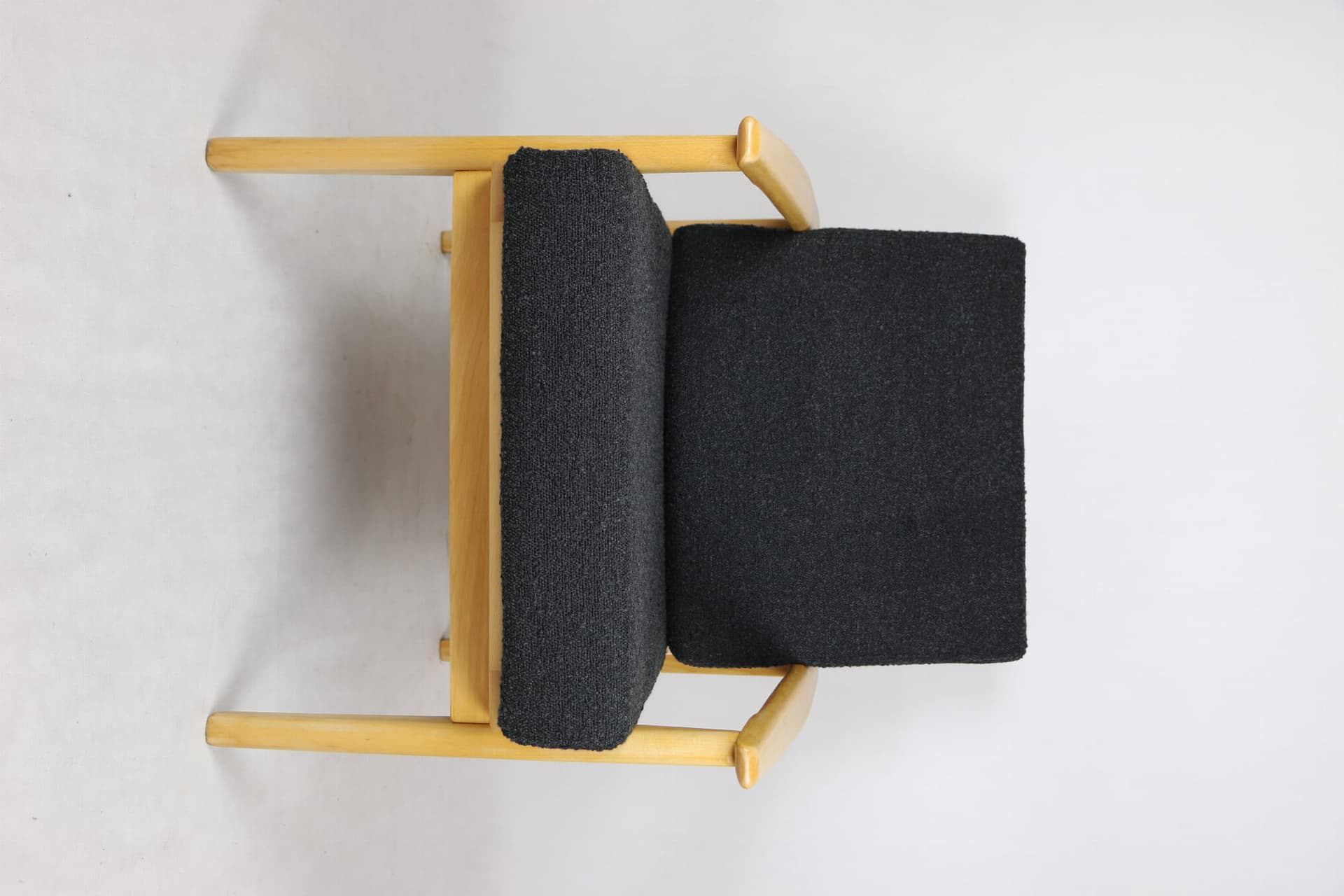Armchair, black boucle, light wood, Denmark, 1970s. - 107347