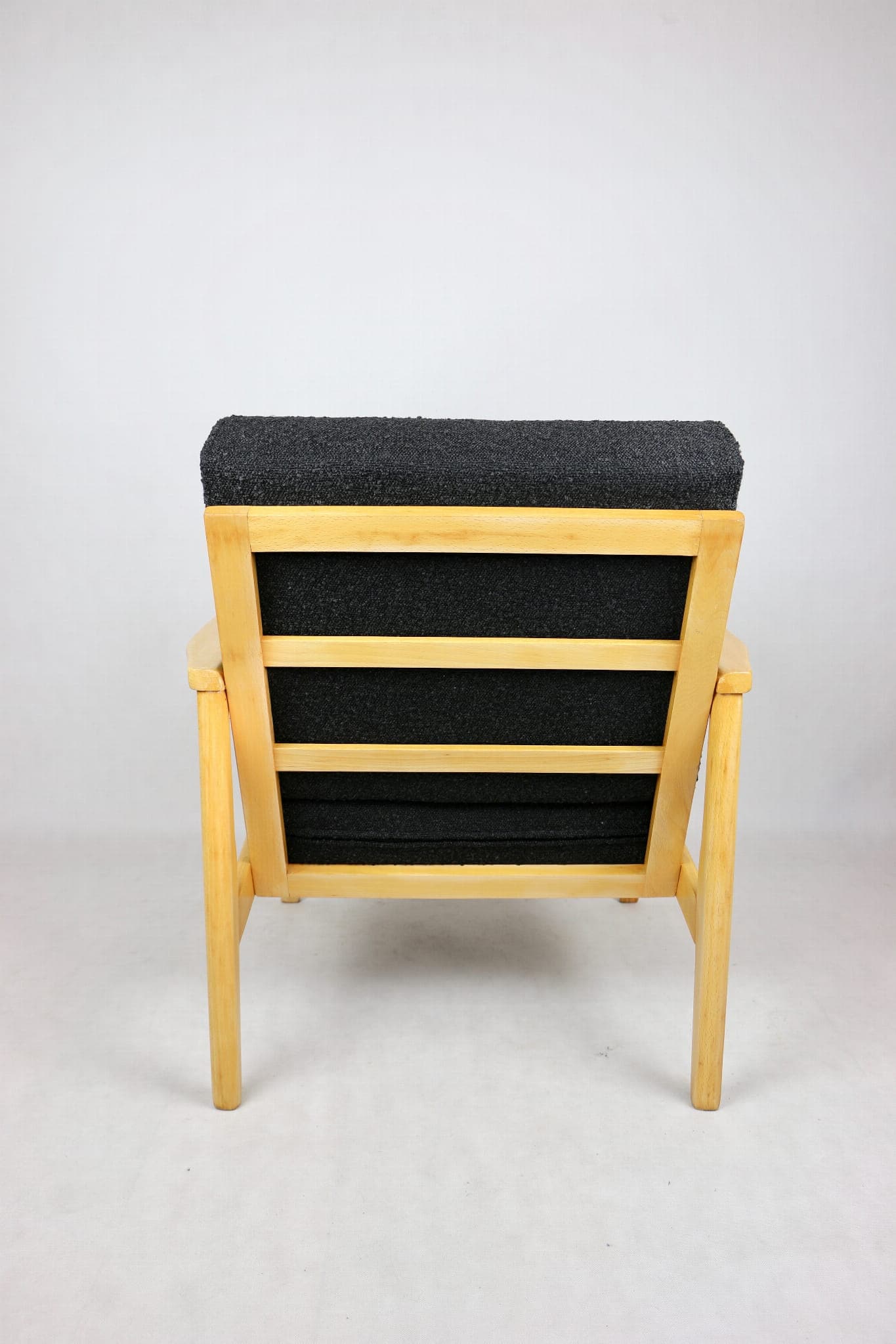 Armchair, black boucle, light wood, Denmark, 1970s. - 107342