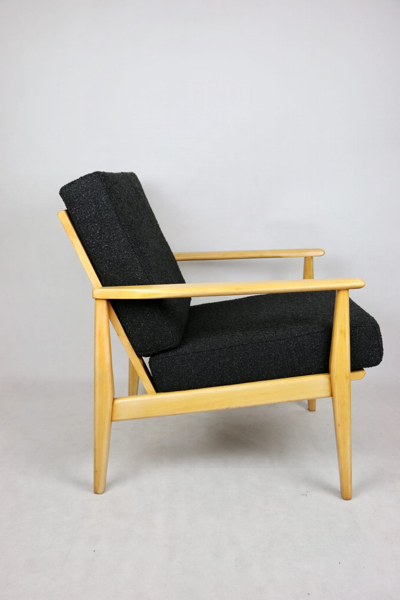 Armchair, black boucle, light wood, Denmark, 1970s. - 107340