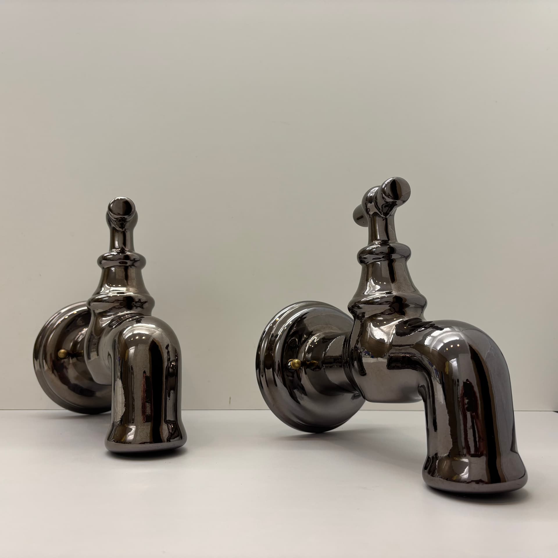 Pair of postmodern wall sconces, graphite, ceramic, Italy, 1990s. - 124190