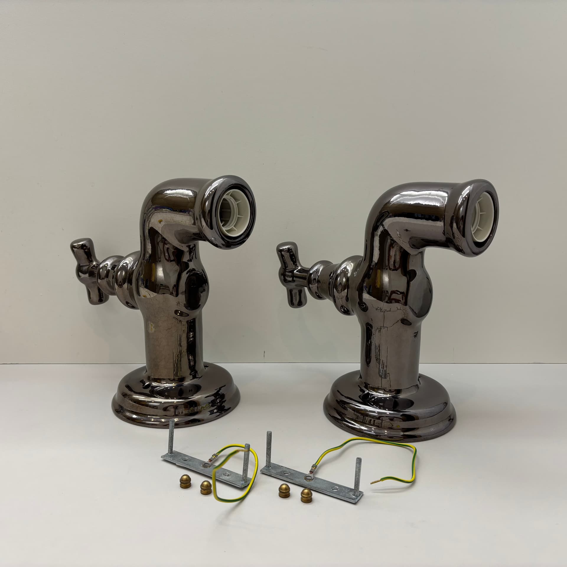 Pair of postmodern wall sconces, graphite, ceramic, Italy, 1990s. - 124196