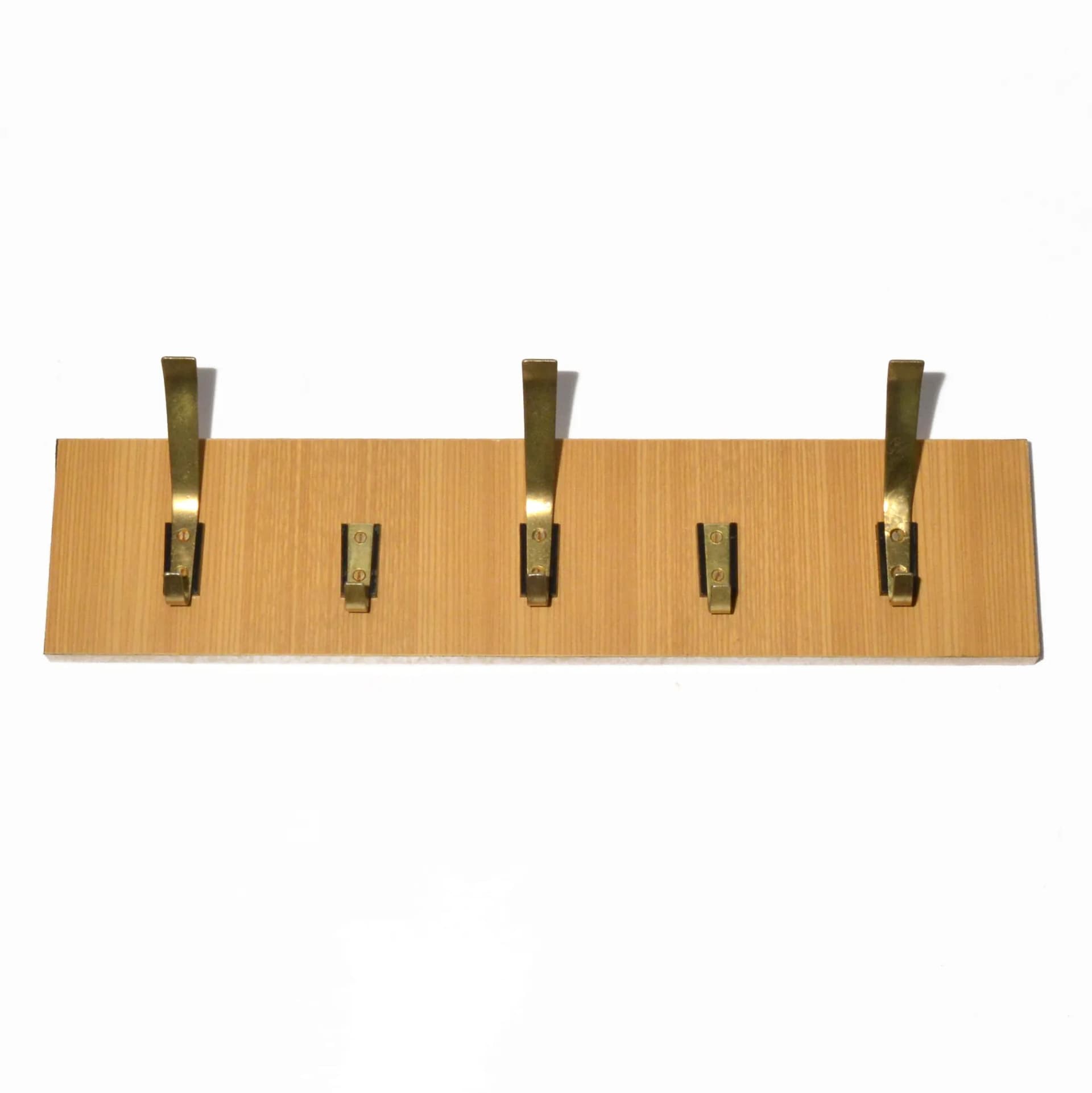 Wall-mounted rack, brown plywood, golden brass, VEB Deutsche Werkstätten Hellerau, Germany, 1970s. - 126799