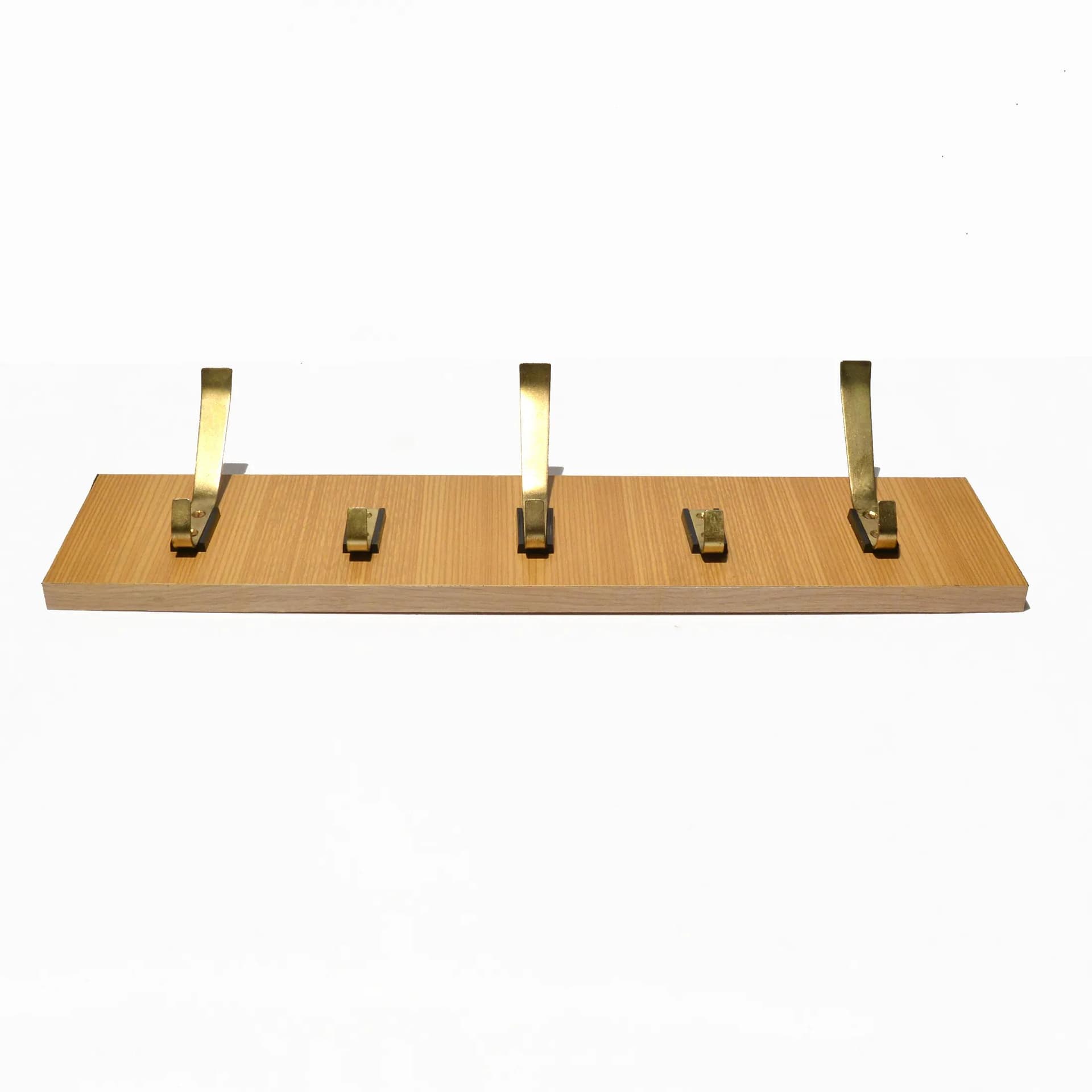 Wall-mounted rack, brown plywood, golden brass, VEB Deutsche Werkstätten Hellerau, Germany, 1970s. - 126800