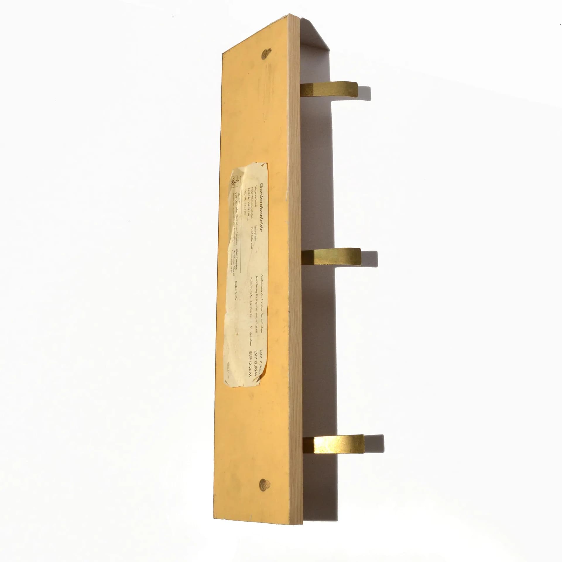 Wall-mounted rack, brown plywood, golden brass, VEB Deutsche Werkstätten Hellerau, Germany, 1970s. - 126801