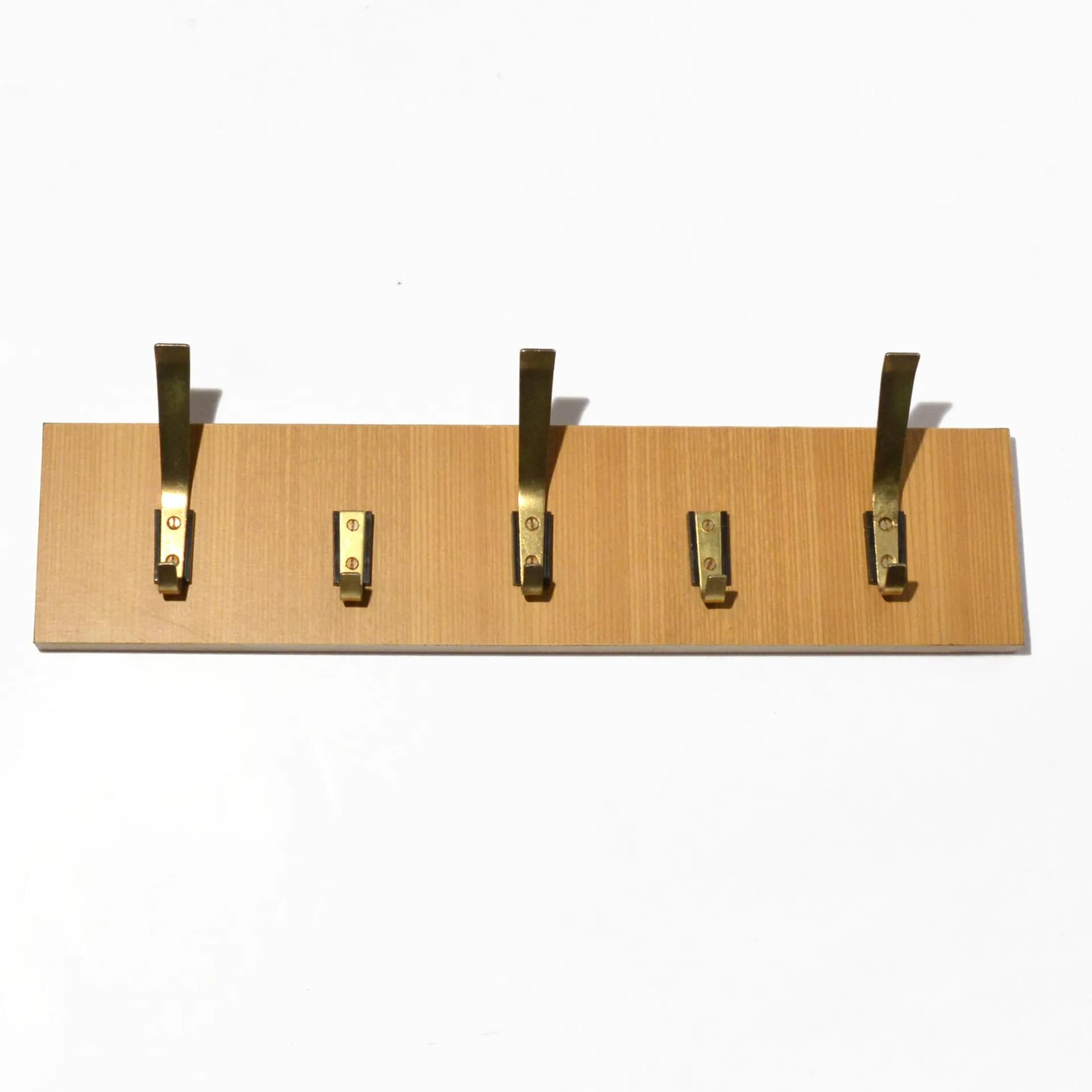Wall-mounted rack, brown plywood, golden brass, VEB Deutsche Werkstätten Hellerau, Germany, 1970s. - 126802