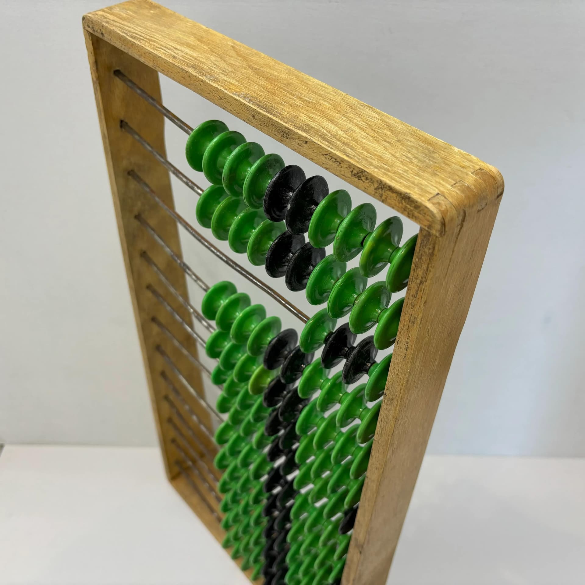 Abacus, beech wood honey, metal, green black plastic, Poland, 1960s. - 8922