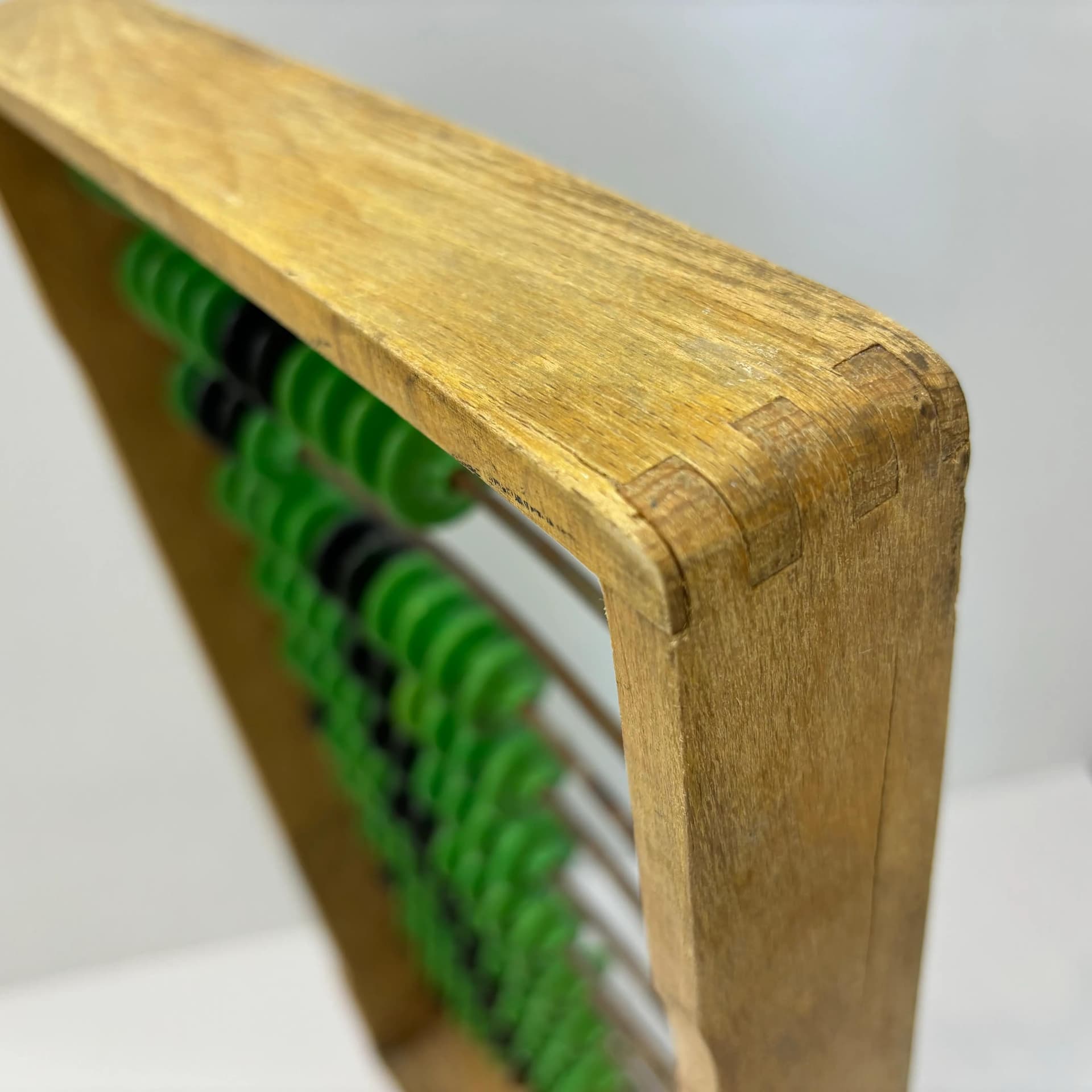 Abacus, beech wood honey, metal, green black plastic, Poland, 1960s. - 8924