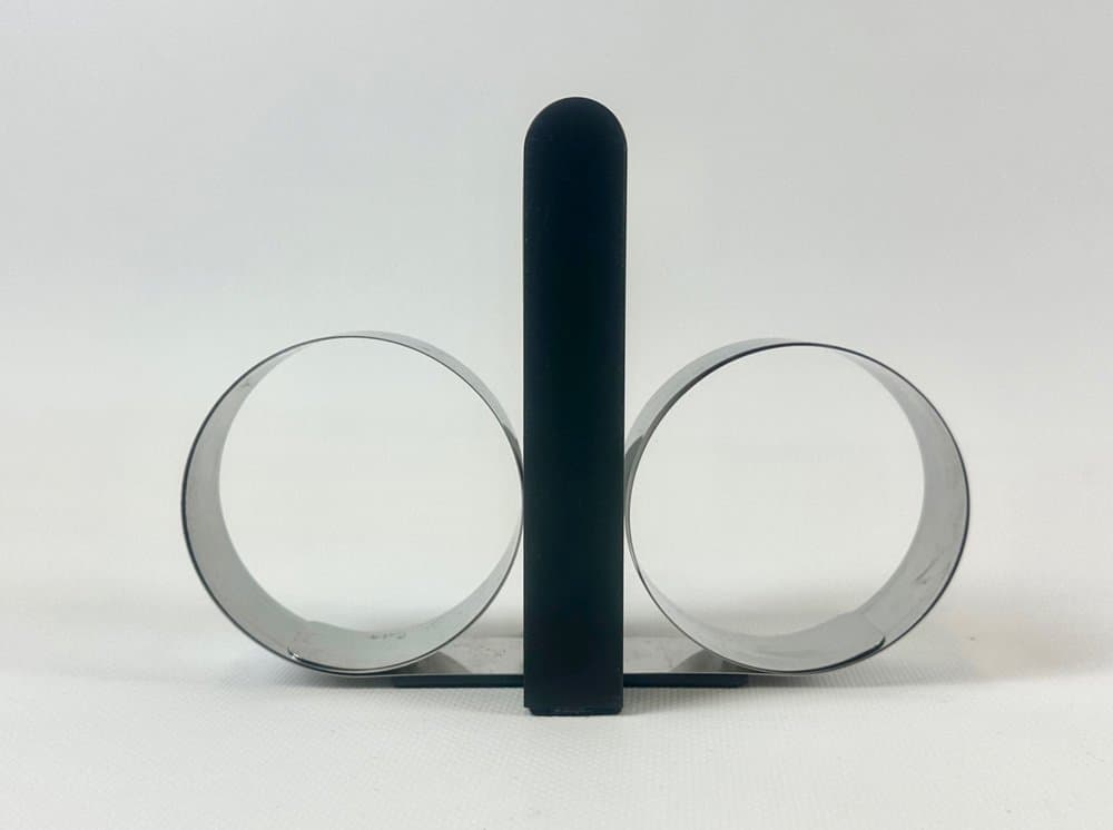 Podpórka do książek, czarny plastik, stal, proj. A. Mikkelsen, Georg Jensen, Dania, lata 90. - 152527