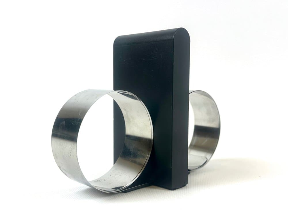 Podpórka do książek, czarny plastik, stal, proj. A. Mikkelsen, Georg Jensen, Dania, lata 90. - 152523