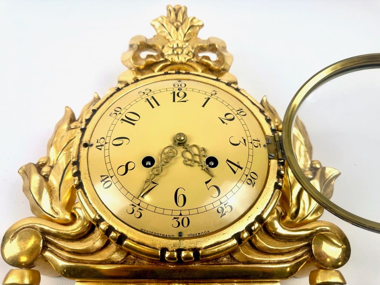 Wall clock, Rococo style, golden, wood, Sweden, 1960s. - 153589