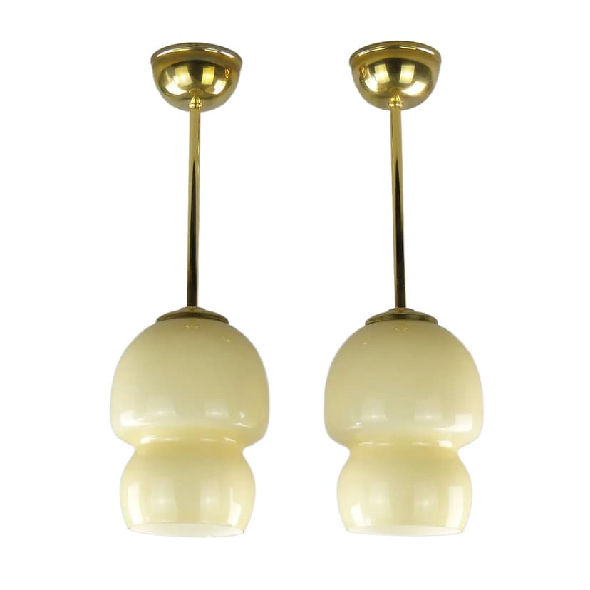 Pair of ceiling lamps, ecru glass, brass, Poland, 1950s.