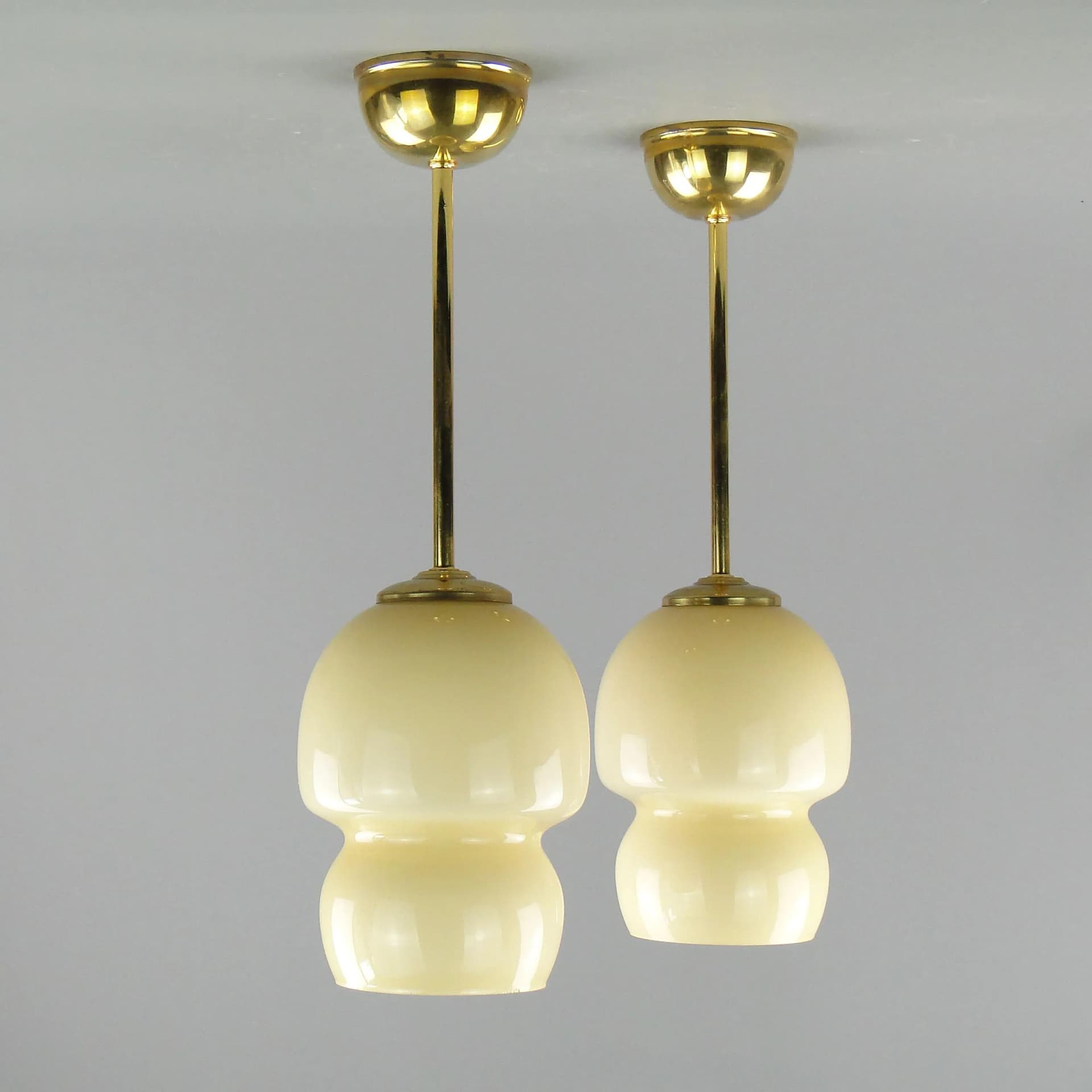 Pair of ceiling lamps, ecru glass, brass, Poland, 1950s. - 163287