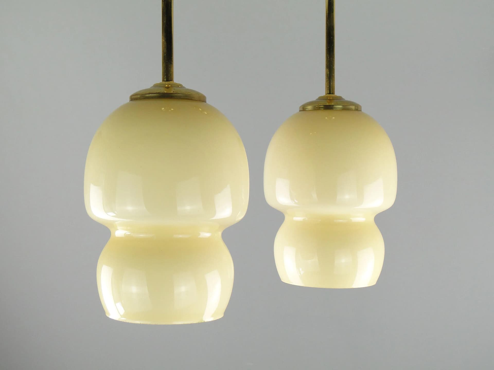 Pair of ceiling lamps, ecru glass, brass, Poland, 1950s. - 163288