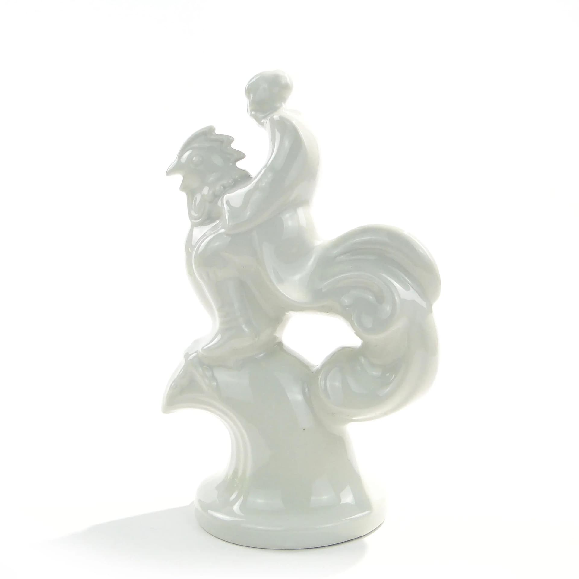 Figurka Twardowski na kogucie, porcelana biała, proj. T. Szafran, Ćmielów, Polska, lata 30. - 162614