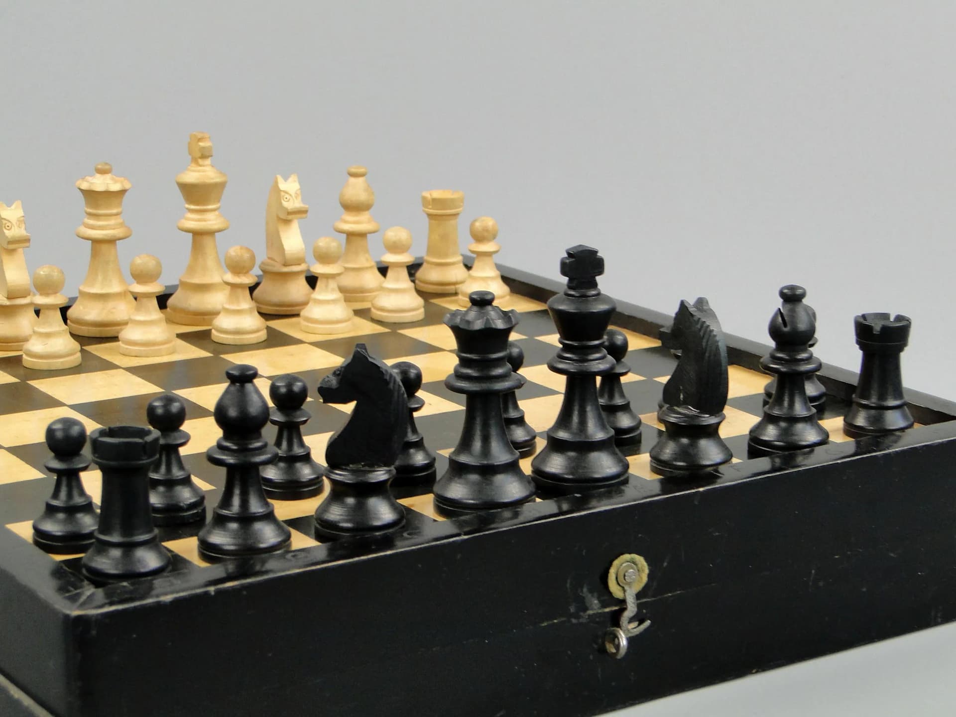 Chess set, black, light wood, black wood, Poland, 1960s. - 11604