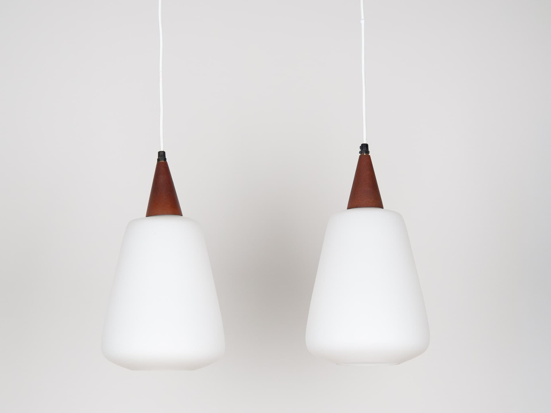 Pair of pendant lamps, opal white glass, teak, Denmark, 1980s. - 179096