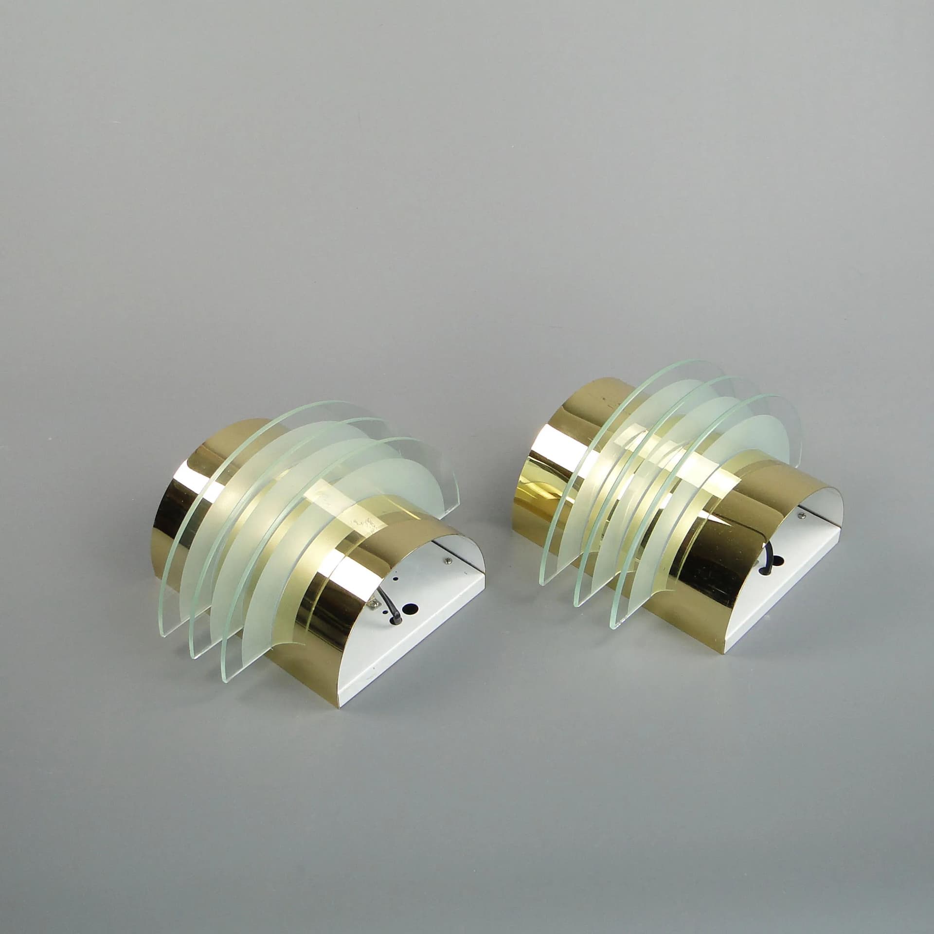 Pair of modernist wall sconces, golden brass, clear glass, Germany, 1970s - 13237