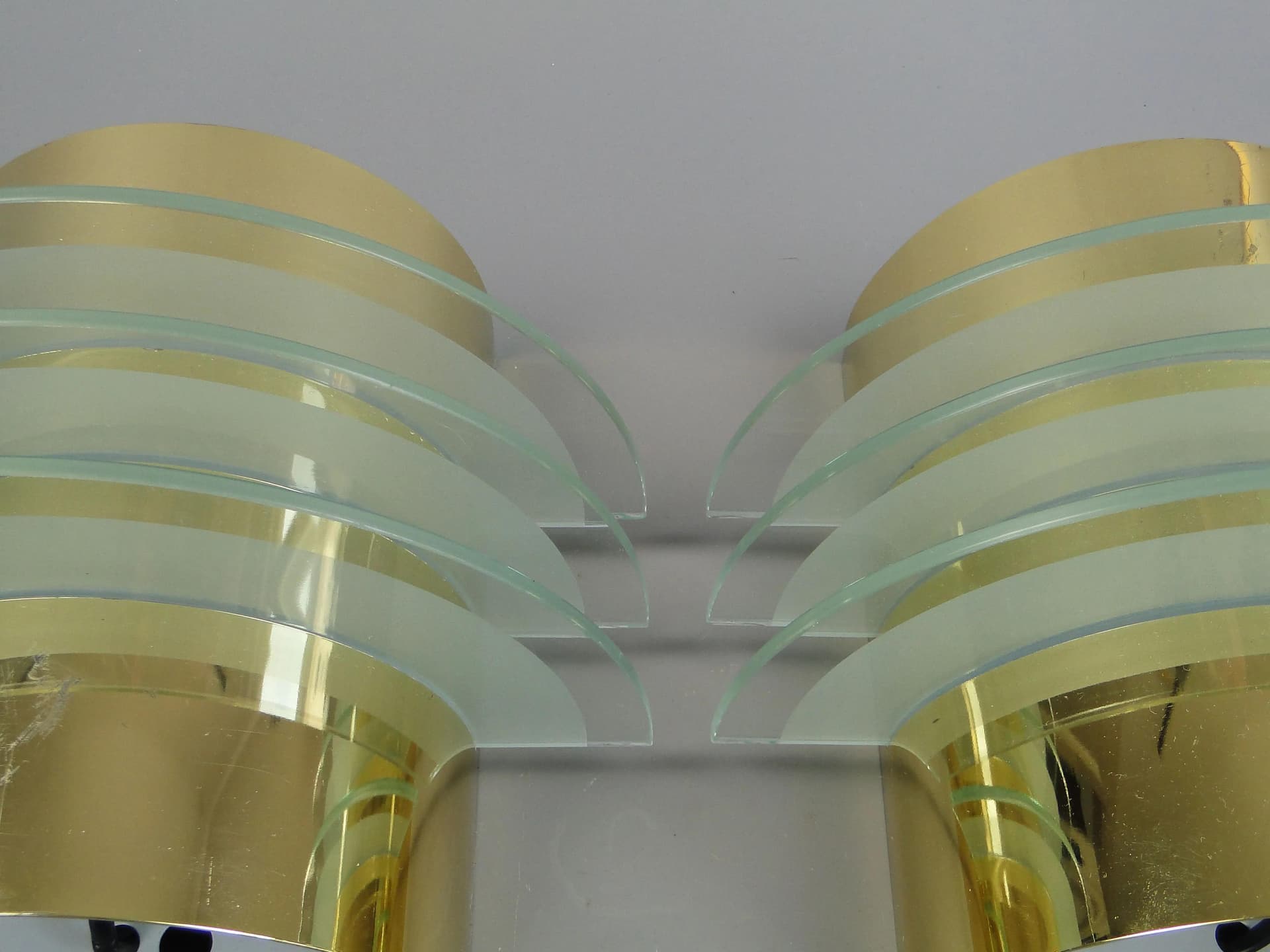 Pair of modernist wall sconces, golden brass, clear glass, Germany, 1970s - 13235