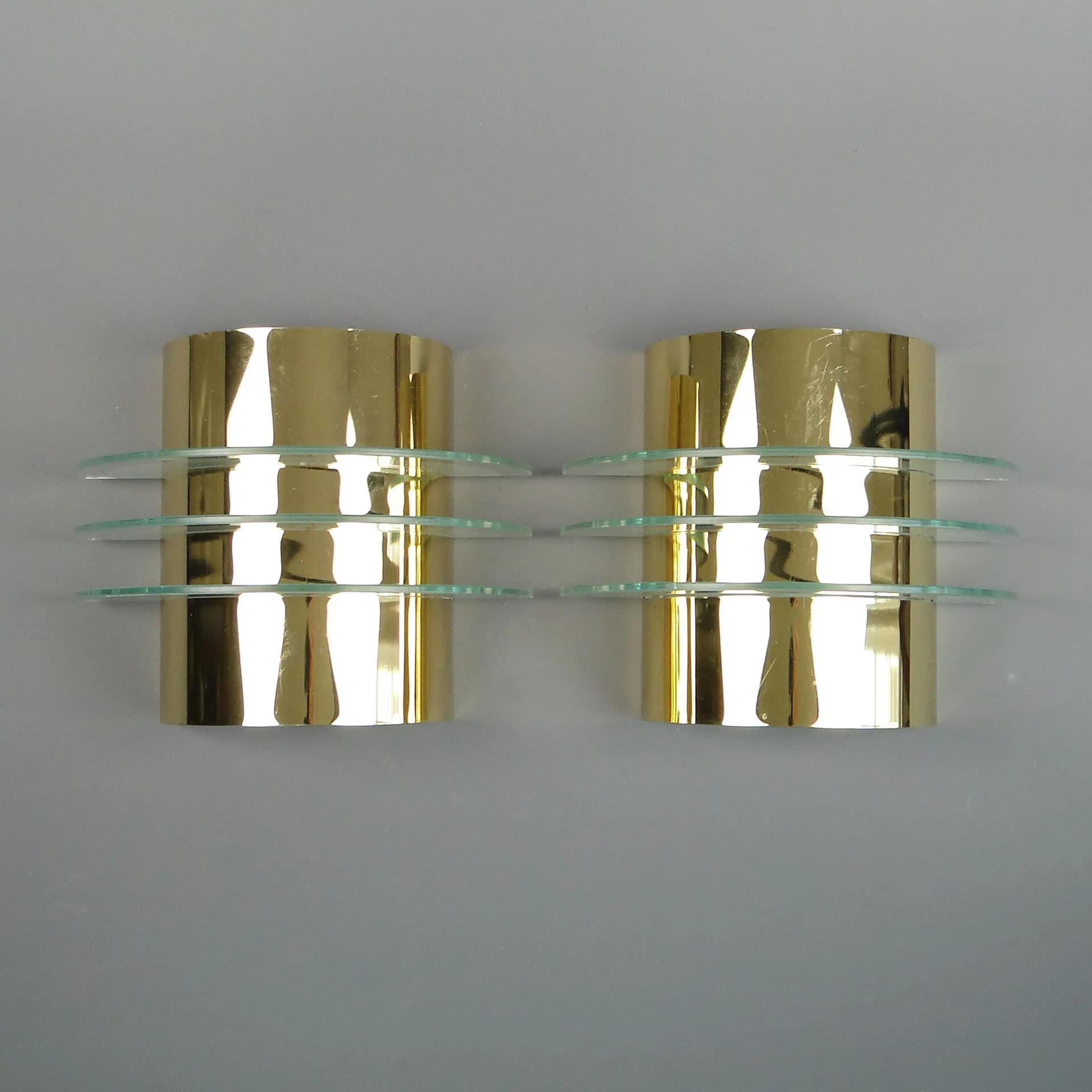 Pair of modernist wall sconces, golden brass, clear glass, Germany, 1970s - 13234