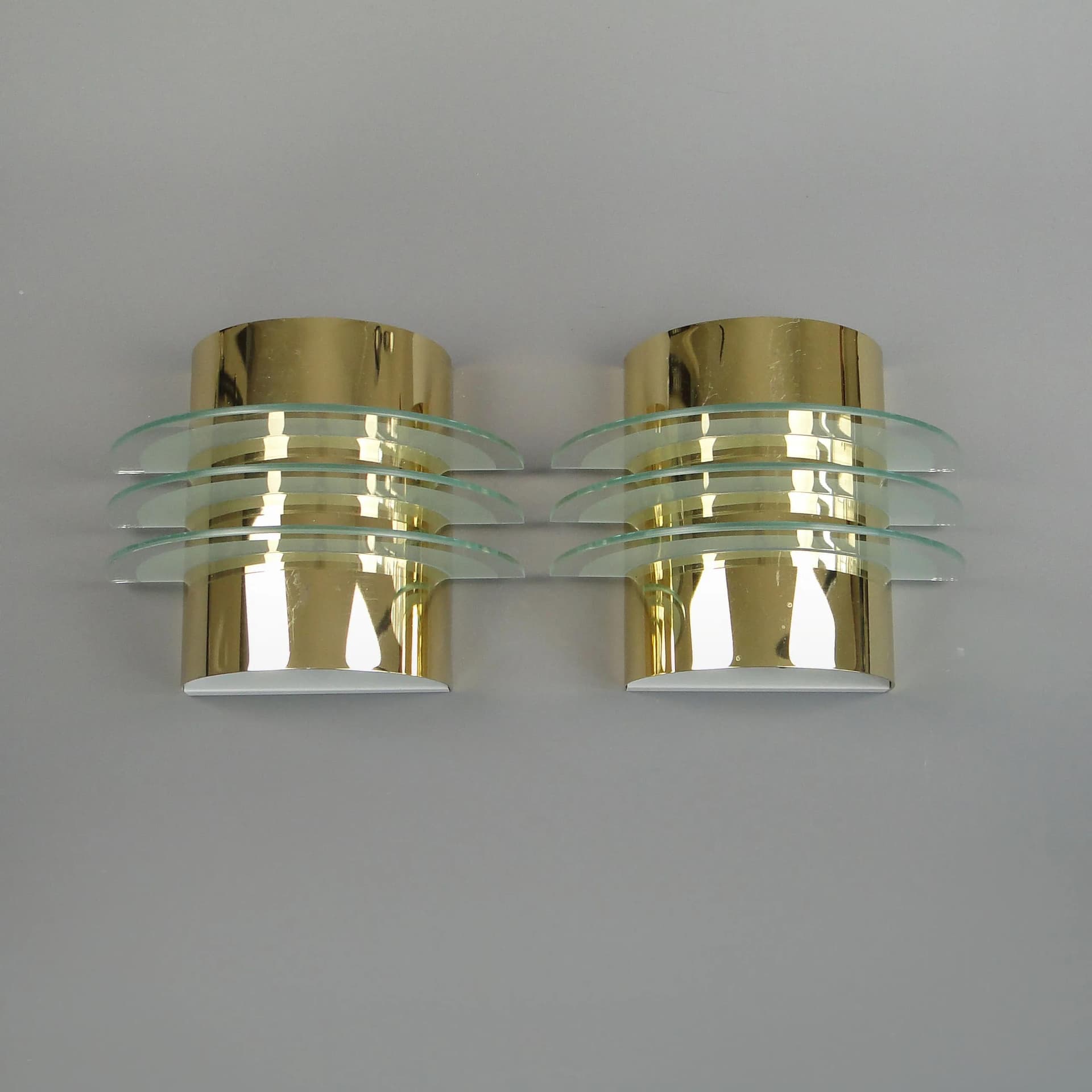 Pair of modernist wall sconces, golden brass, clear glass, Germany, 1970s - 13233