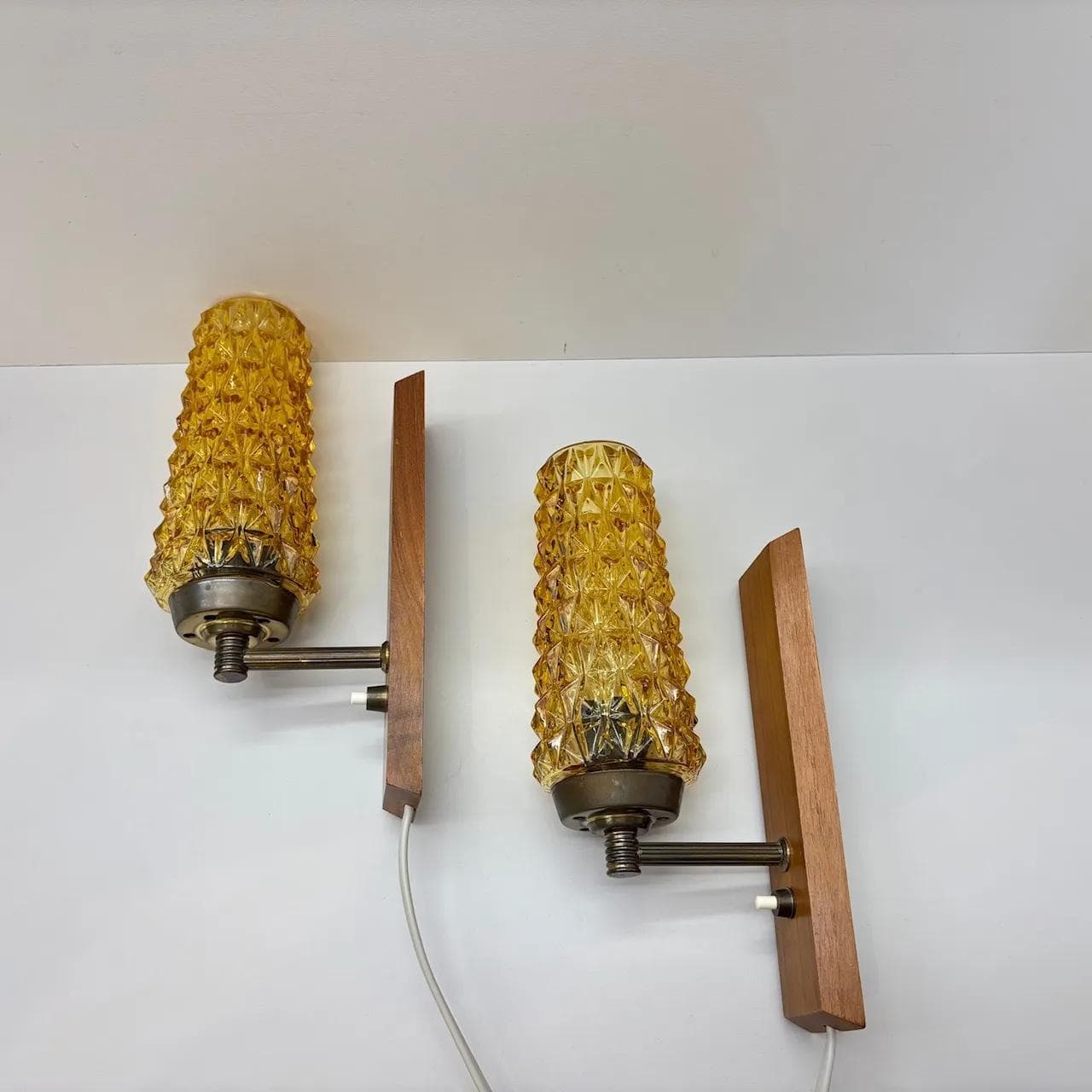 Pair of wall sconces, teak, amber glass, Denmark, 1970s. - 15071