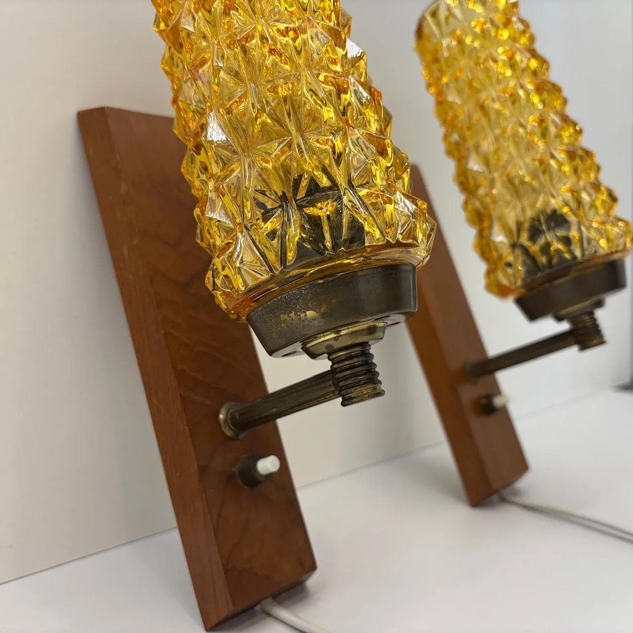 Pair of wall sconces, teak, amber glass, Denmark, 1970s. - 15077