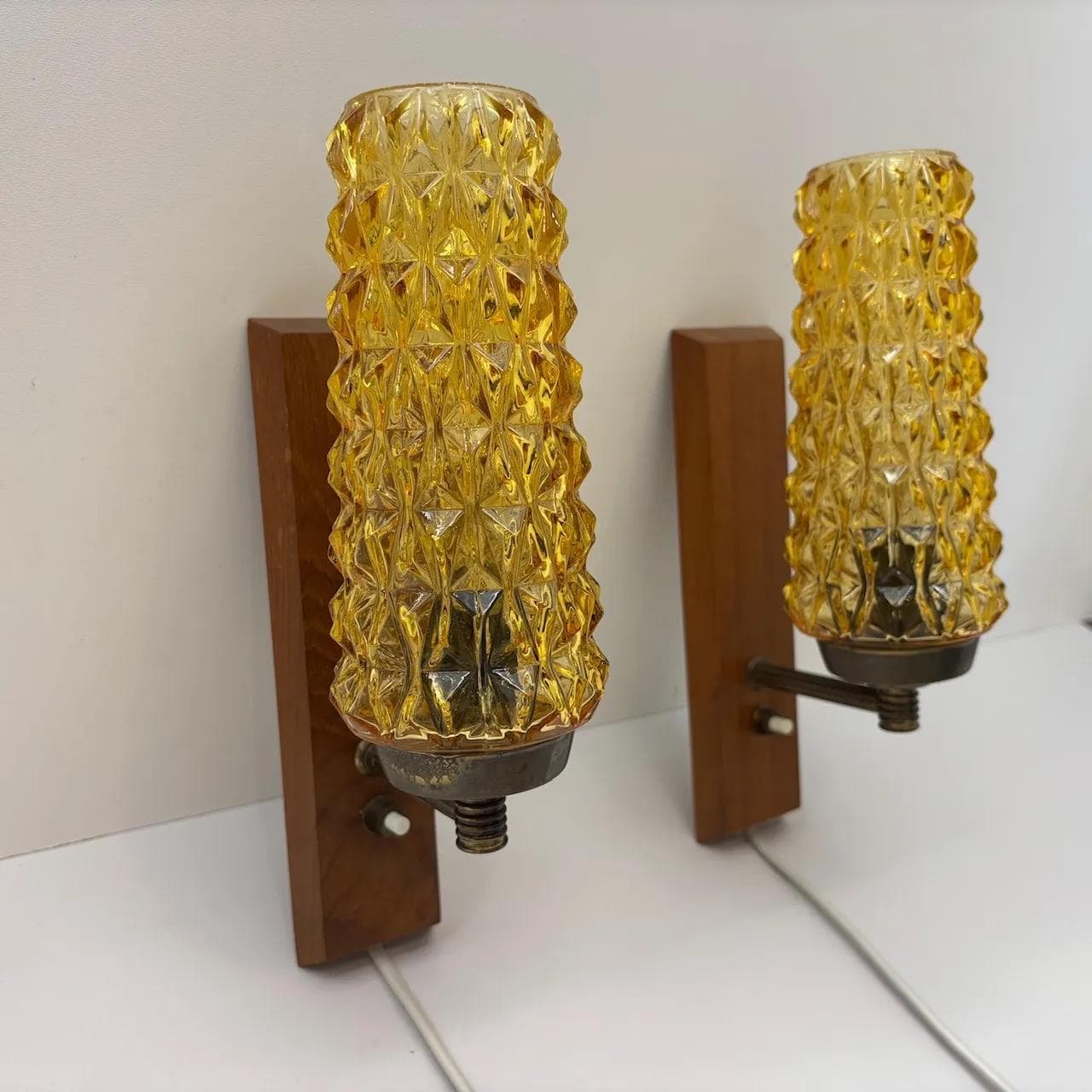 Pair of wall sconces, teak, amber glass, Denmark, 1970s. - 15078