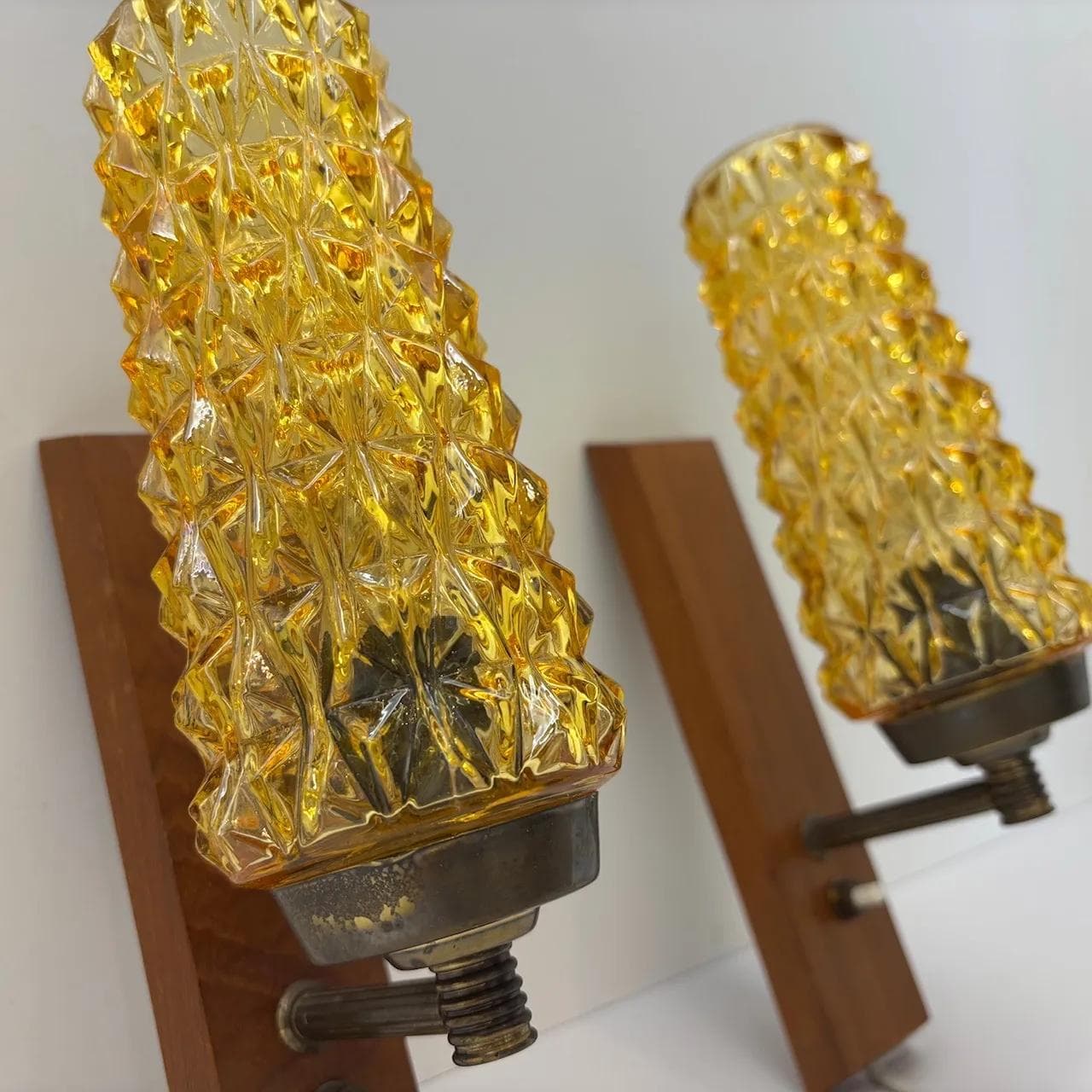 Pair of wall sconces, teak, amber glass, Denmark, 1970s. - 15075