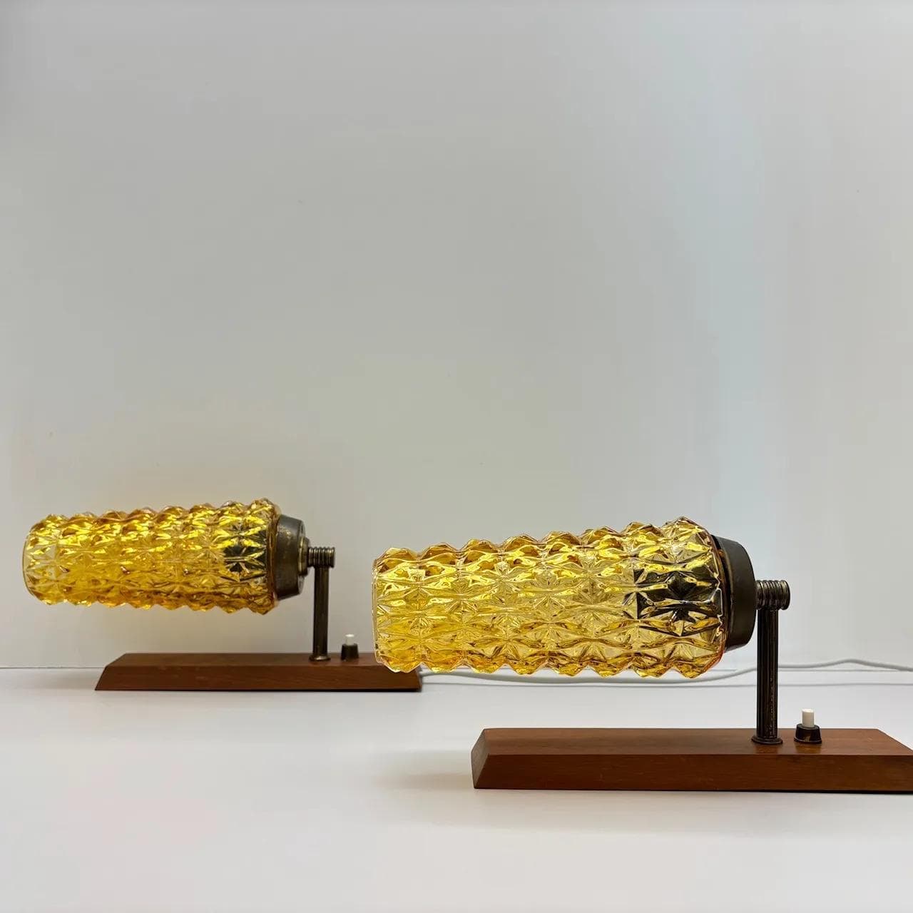 Pair of wall sconces, teak, amber glass, Denmark, 1970s. - 15074